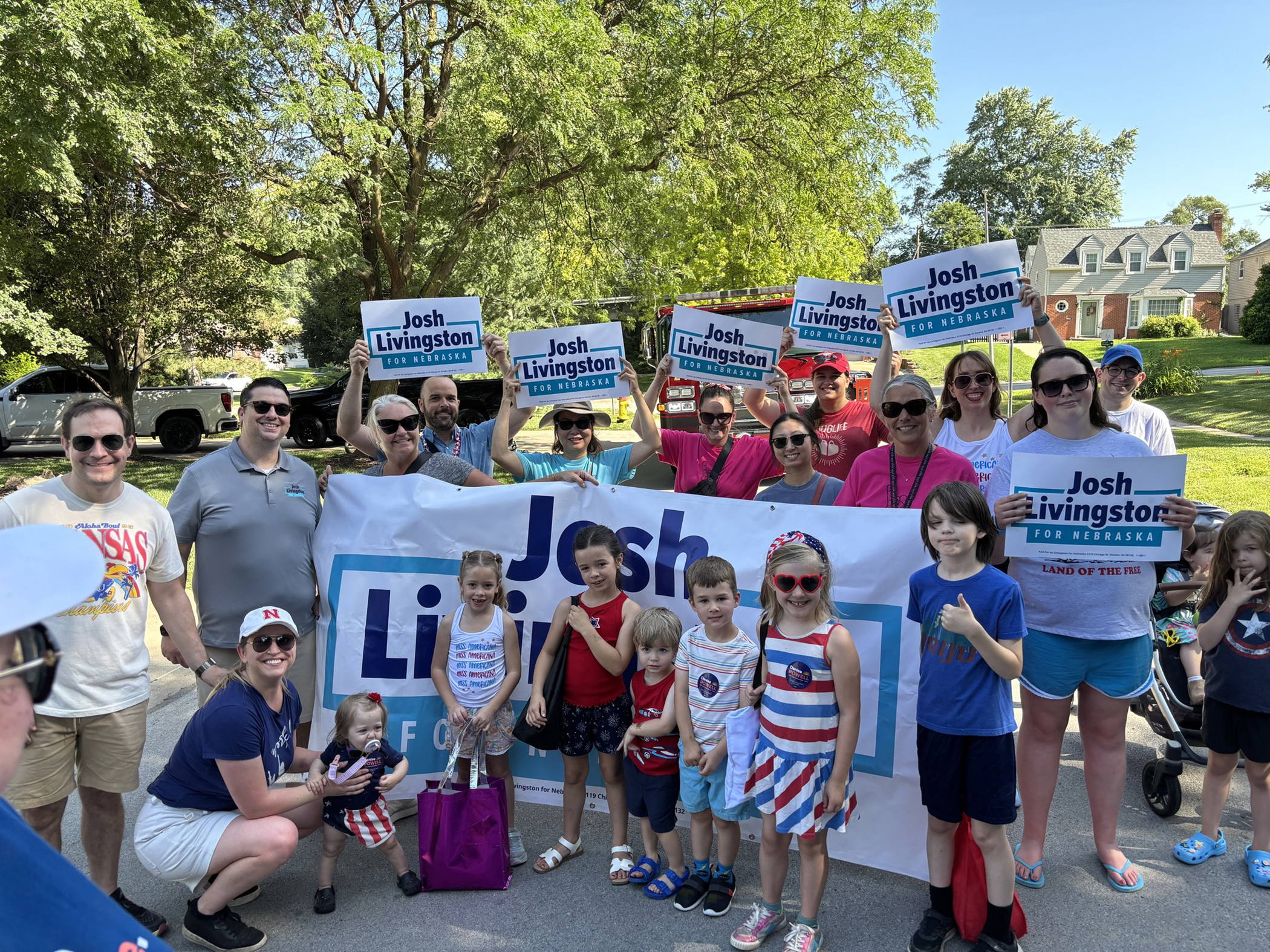 Attorney Joshua Livingston, who recently announced his run for the Nebraska State Legislature, District 8, and his avid supporters were among participants in the 75th annual JE George July 4 Parade, celebrating America and community.<br />(Courtesy of Dana Livingston)