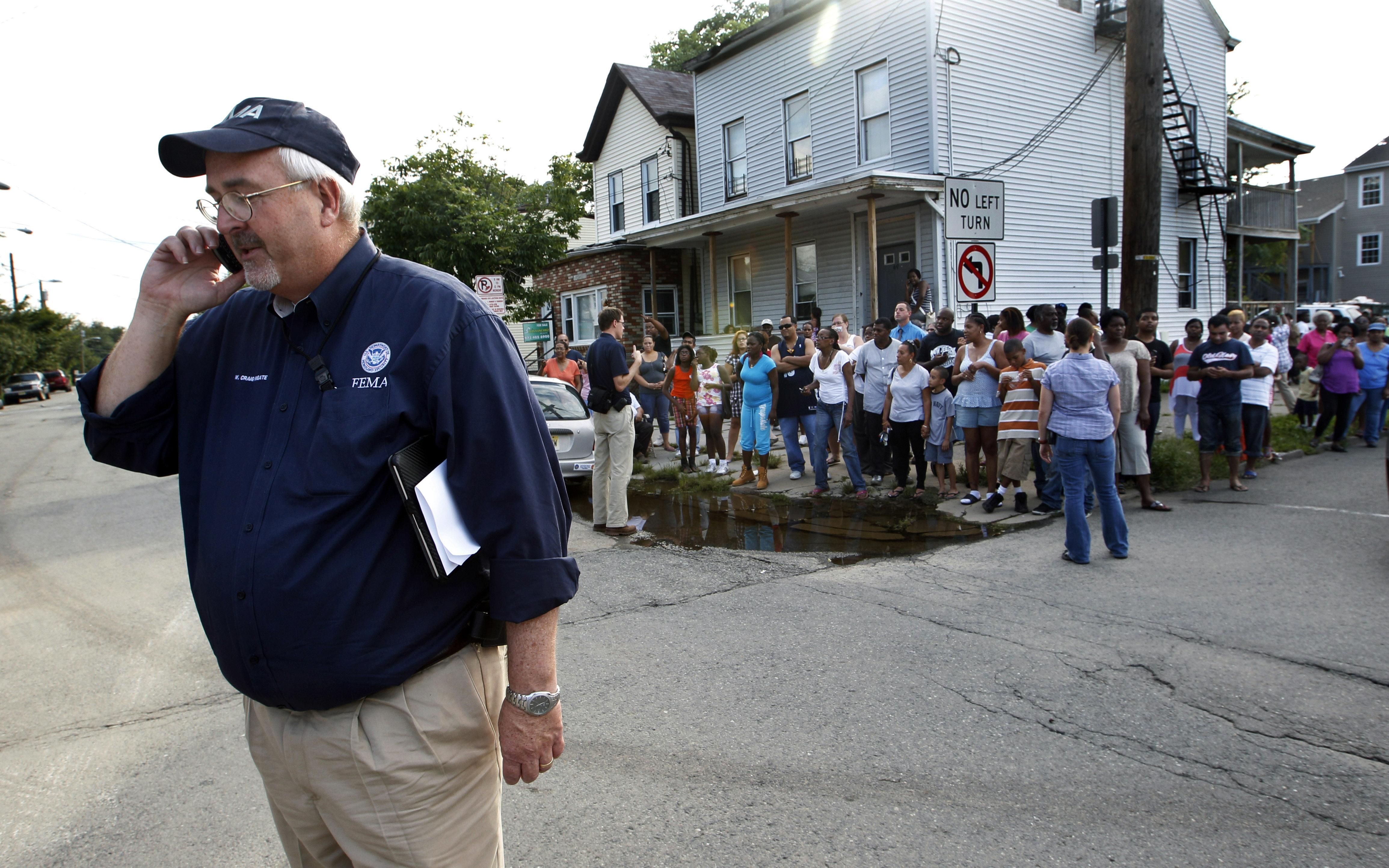 Federal Emergency Management Agency administrator W. Craig Fugate talks on the telephone Wednesday, Aug. 31, 2011, in Paterson, New Jersey.<br />(Mel Evans / AP Photo)