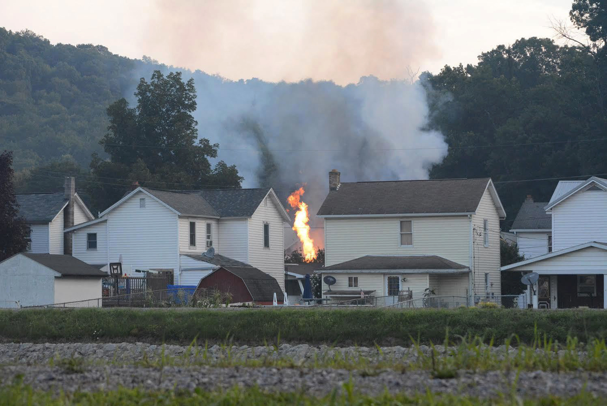 Early on the morning of Aug. 2, 2017, CSX Train Q38831 was traveling east toward Hyndman, Pennsylvania. The train was 2 miles long and weighed over 18,000 tons. It was loaded with innocuous cargo like paper and corn syrup as well as hazardous materials such as propane and molten sulfur. Ninety percent of the train’s weight was behind the leading 42 cars. (Steve Bittner / The Cumberland Times-News via AP)
