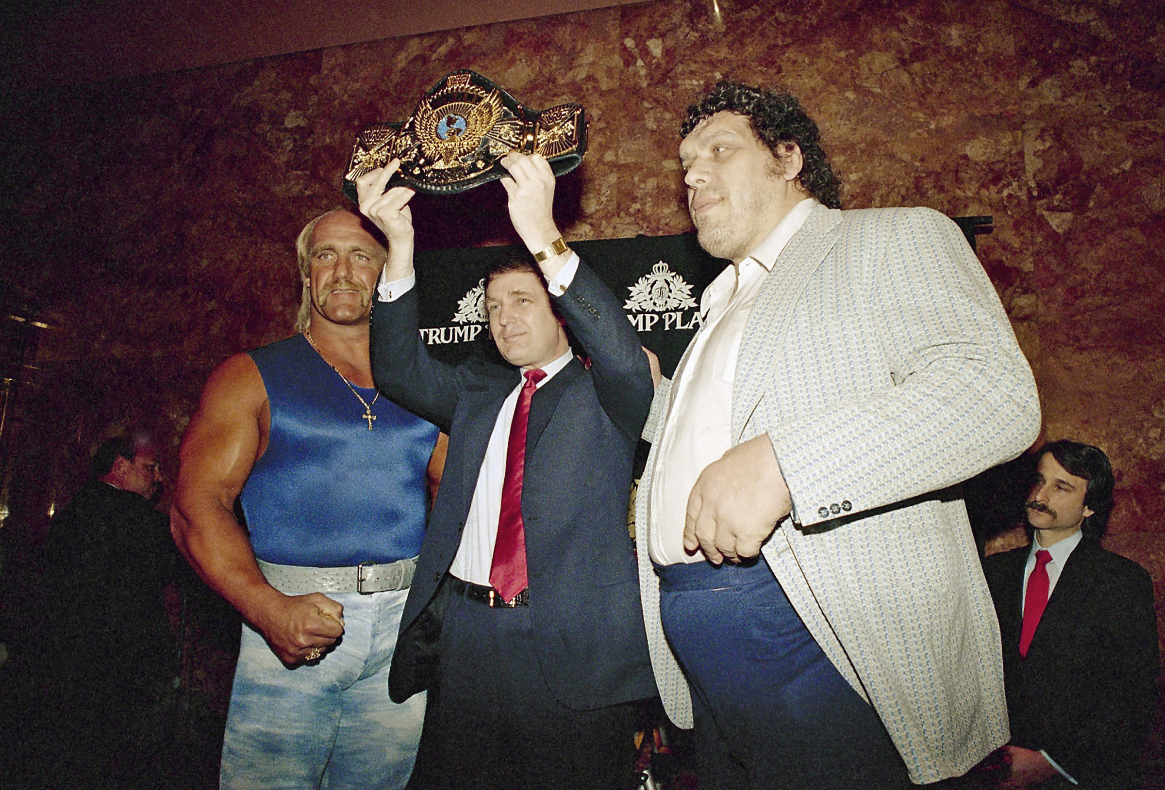 Real estate developer Donald Trump holds the World Wrestling Federation Championship belt as he flanked by Wrestlers Hulk Hogan, left and Andre the Giant at a news conference Tuesday, March 15, 1988 in New York announcing &quot;WrestleMania IV&quot;on March 27 at Trump Plaza in Atlantic City.<br />(Susan Ragan / AP Photo)