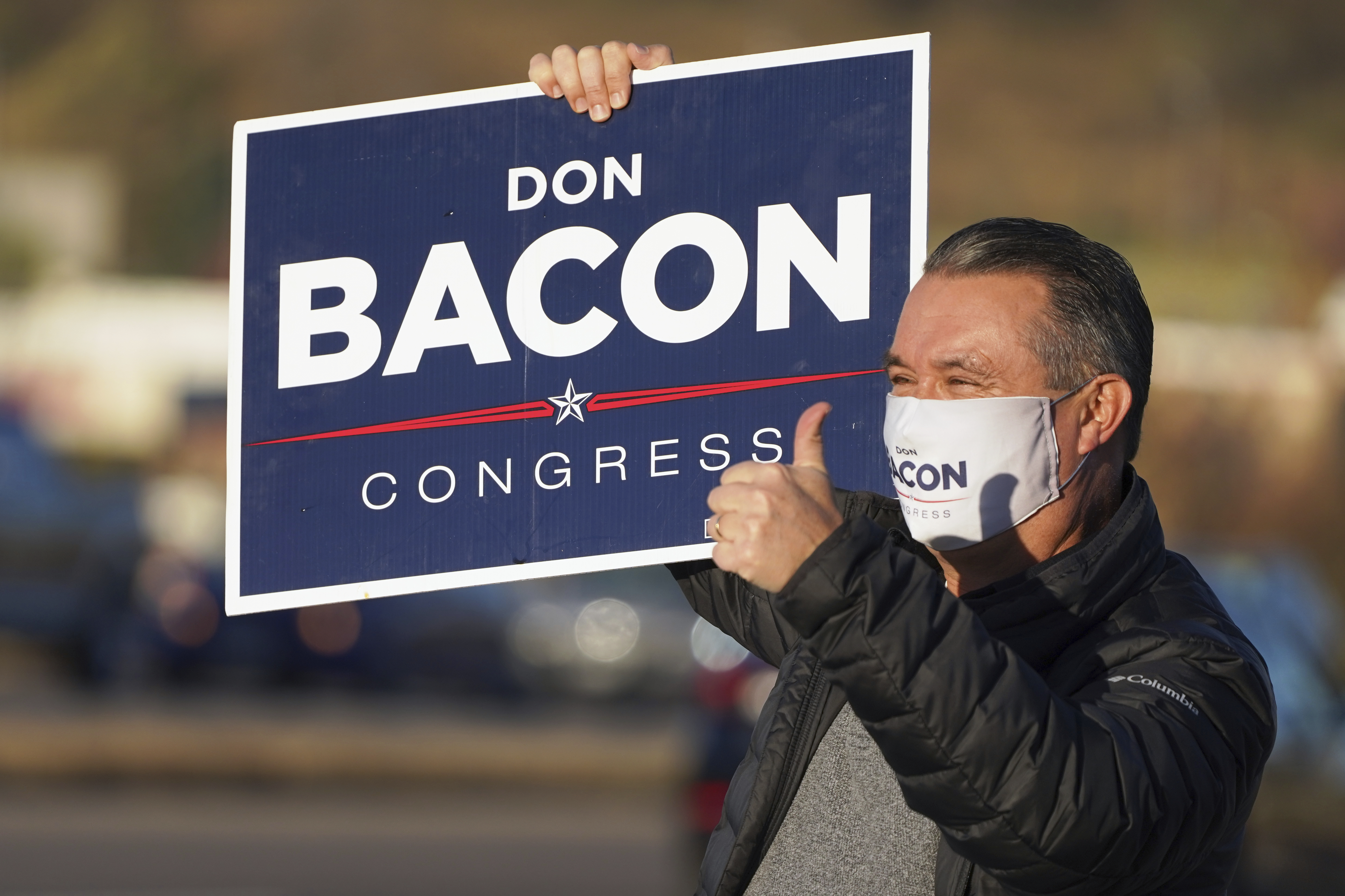 Nebraska 2nd Dist. Rep. Don Bacon, R-Neb., gives a thumbs-up sign as he campaigns at an intersection in Papillion, Neb., Tuesday, Nov. 3, 2020.<br />(Nati Harnik / AP Photo)