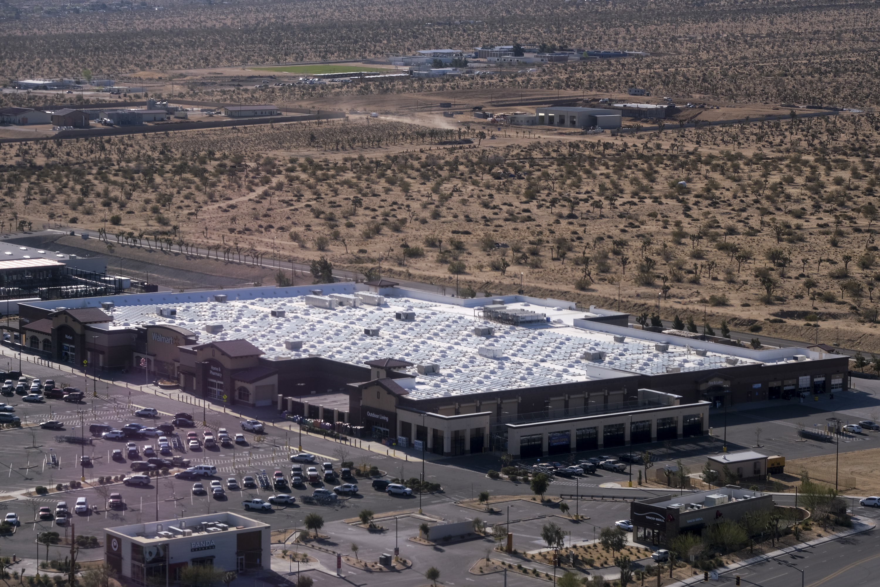An aerial view of solar panels on the top of a Walmart store in Yucca Valley, Calif., Monday, April 5, 2021.<br />(Ringo H.W. Chiu / AP Photo)