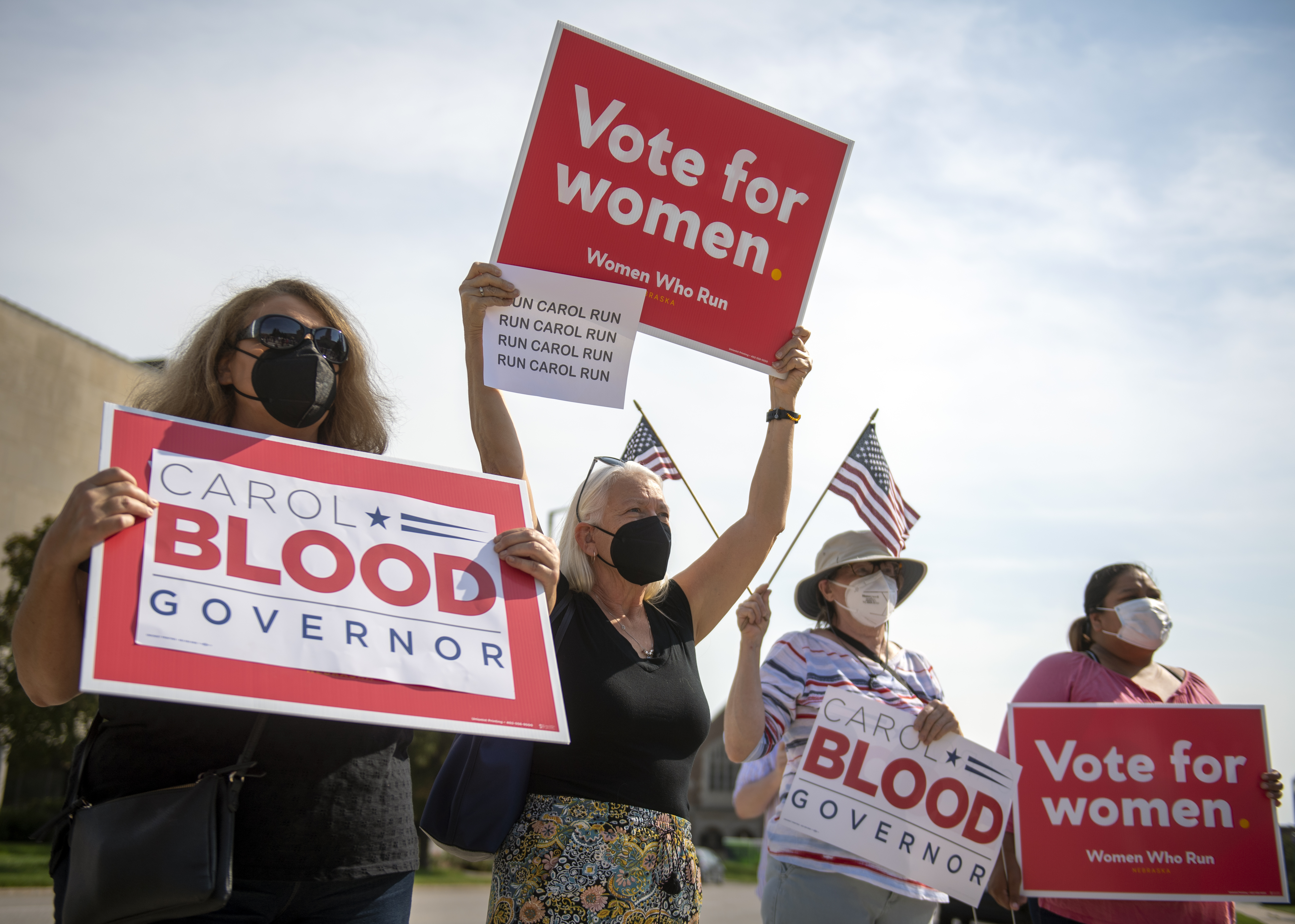 From left, Ann Fintel and Jo Ann Emerson, both of Lincoln, Neb., cheer state Sen. Carol Blood, the Democratic gubernatorial candidate, Monday, Sept. 13, 2021, in Lincoln, Neb.<br />(Justin Wan / Lincoln Journal Star via AP Photo)