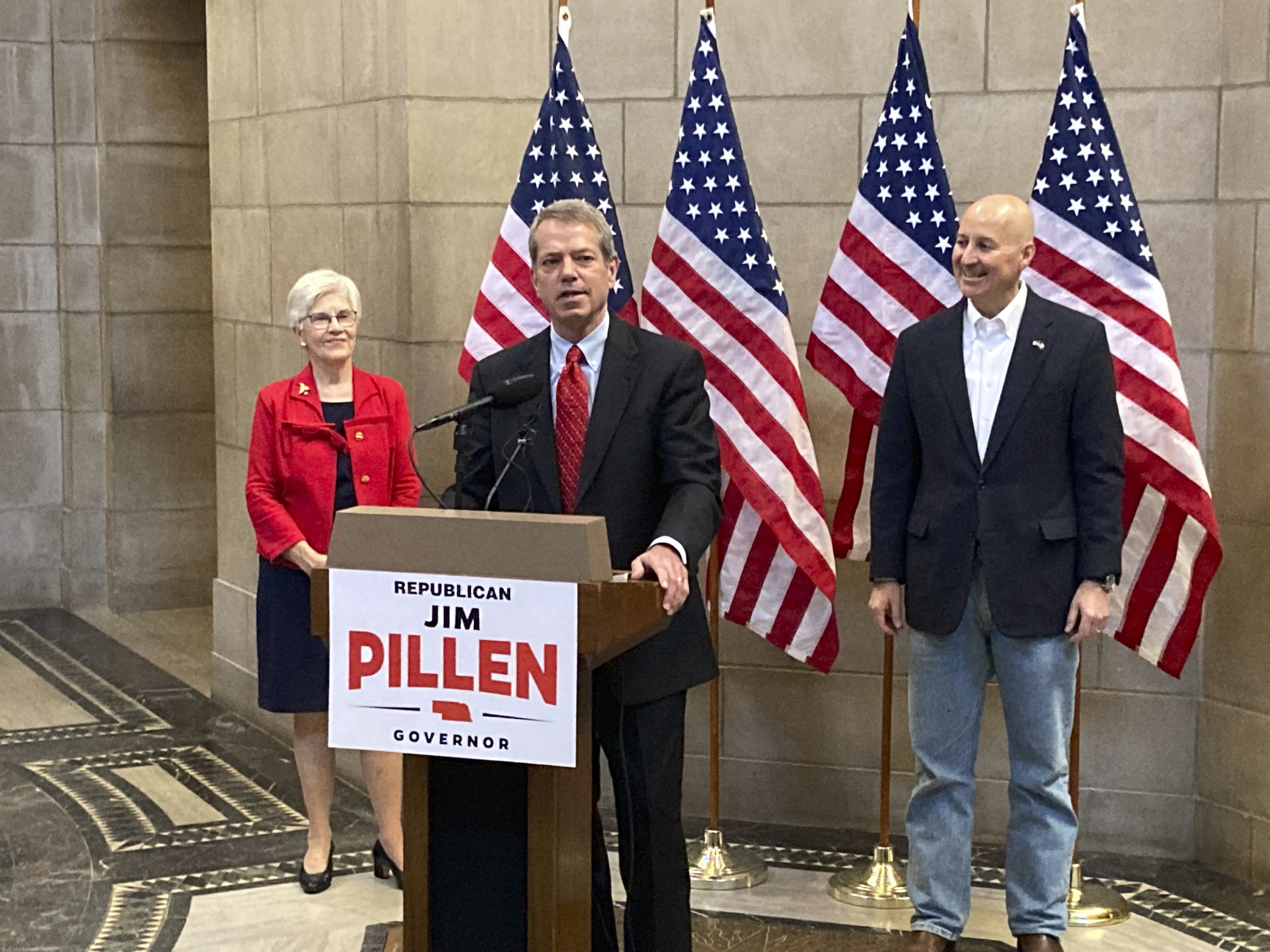 Republican gubernatorial candidate Jim Pillen, center, talks about his campaign after receiving an endorsement from Gov. Pete Ricketts, right, on Tuesday, Jan. 18, 2022, and he’s been endorsed by former Gov. Kay Orr, left.  (Grant Schulte / AP Photo)