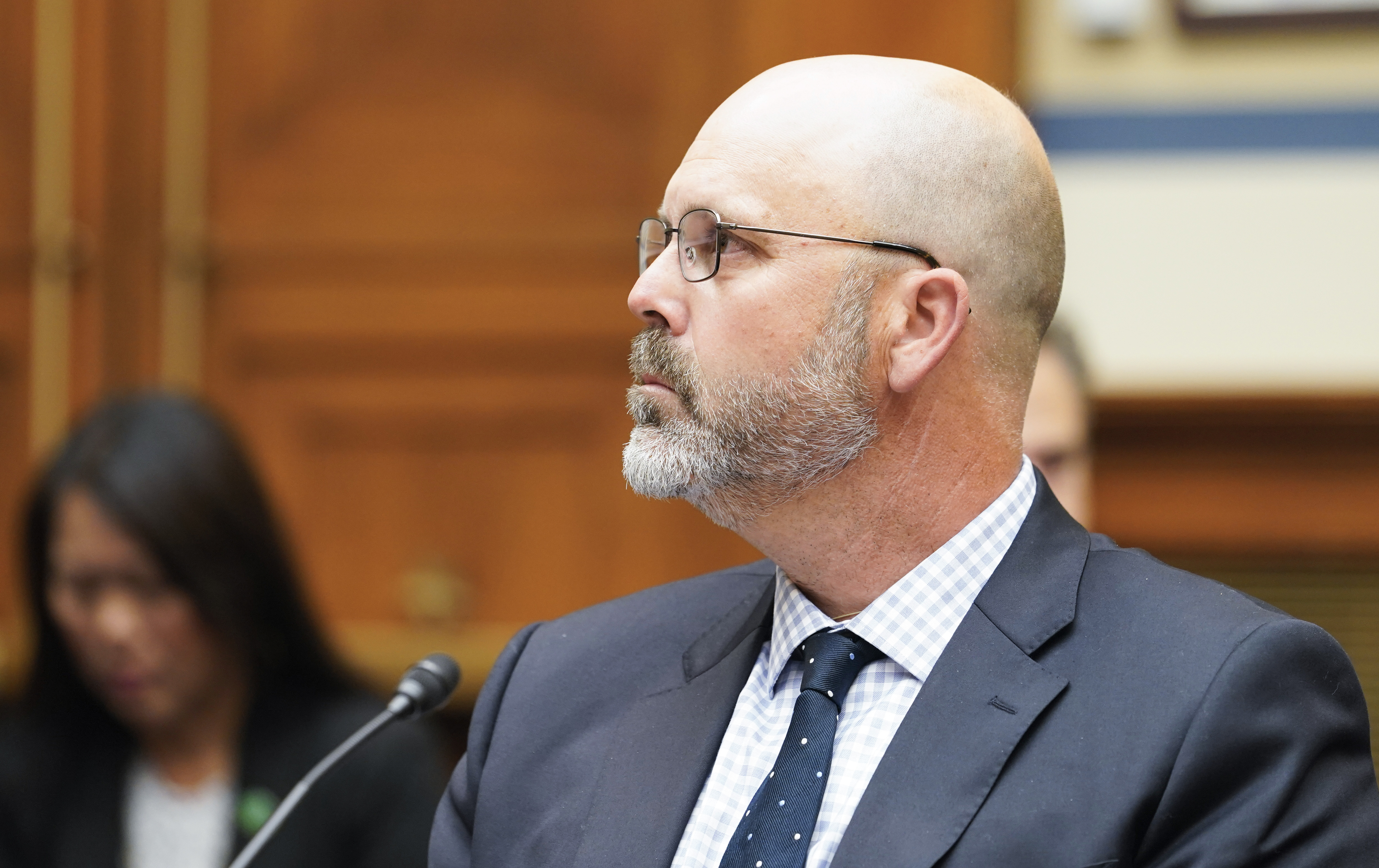 Ryan Busse, senior advisor at Giffords Law Center, listens during a House Committee on Oversight and Reform hearing examining the practices and profits of gun manufacturers, Wednesday, July 27, 2022, on Capitol Hill in Washington. (Mariam Zuhaib / AP Photo)
