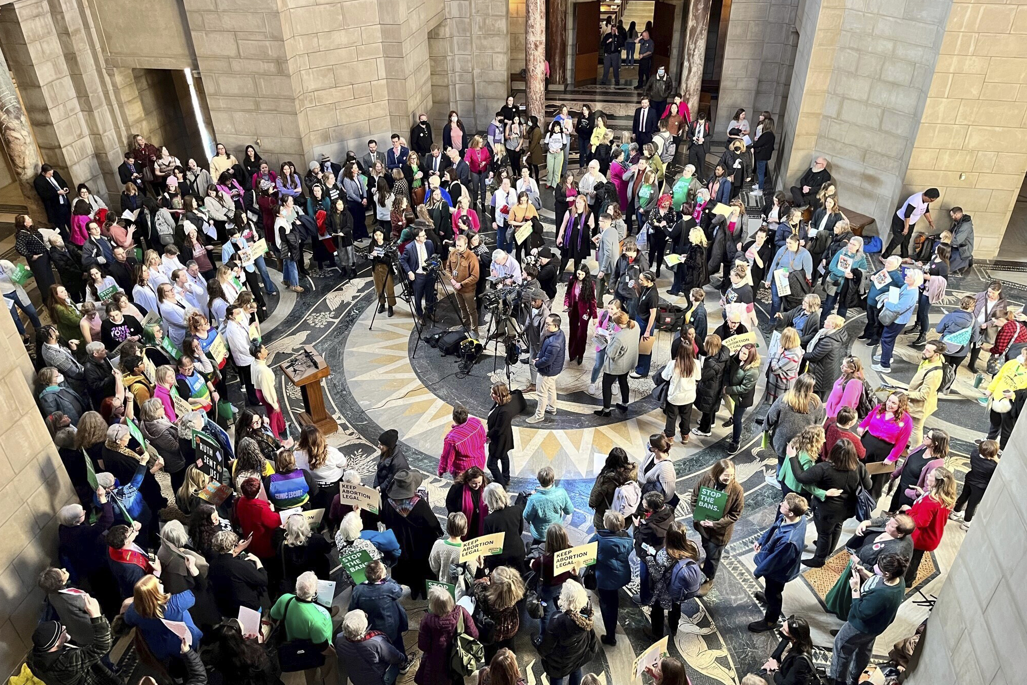 Hundreds of people crowded the Nebraska State Capitol Rotunda on Wednesday, Feb. 1, 2023, in Lincoln. Neb., to protest a so-called heartbeat bill that would outlaw abortion at a point before many women even know they’re pregnant. The bill, which was before the Legislature’s Health and Human Services Committee on Wednesday, would ban abortions once cardiac activity can be detected in a embryo, which is generally around the sixth week of pregnancy. (Margery A. Beck / AP Photo)