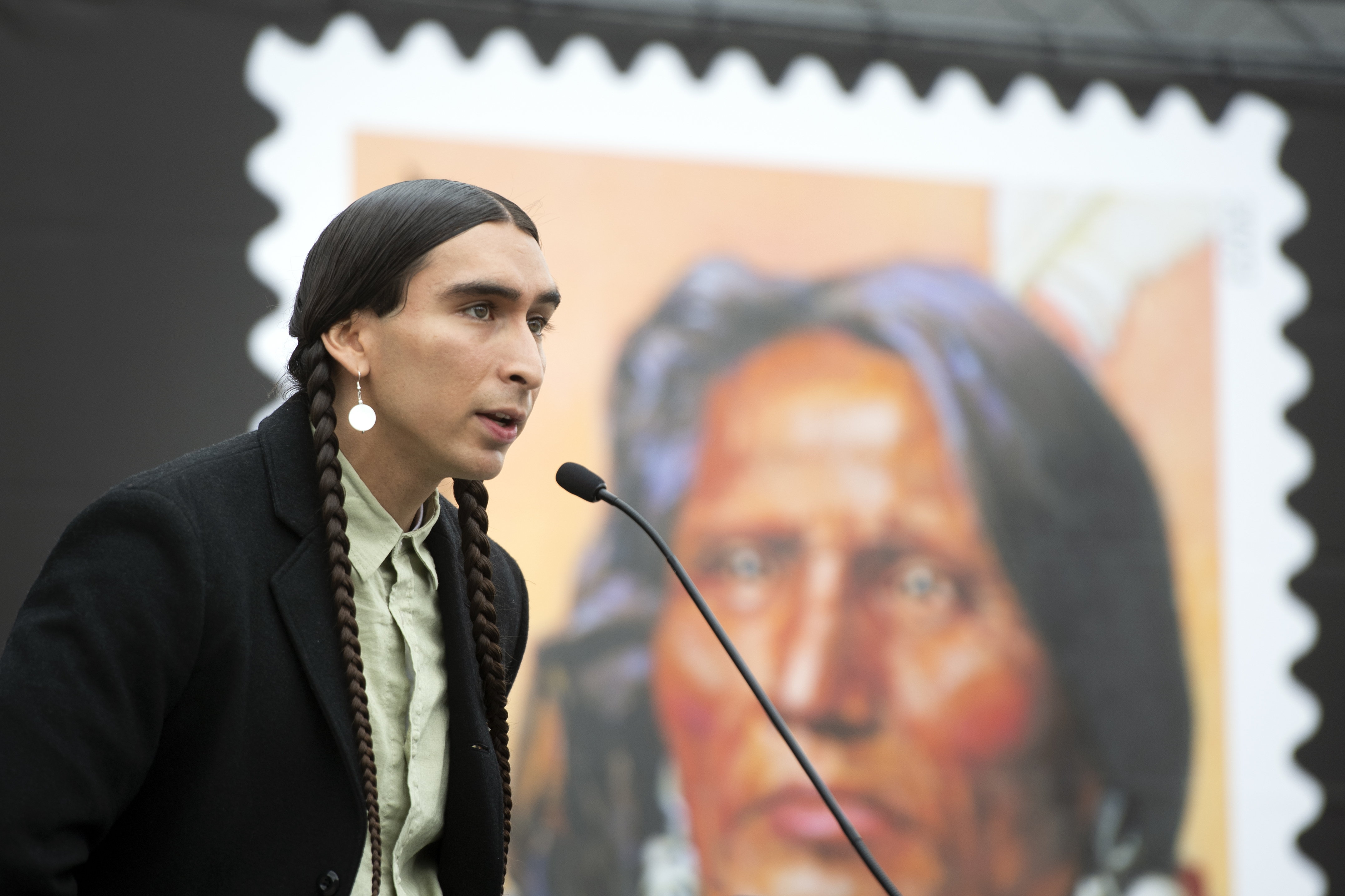 Steve Laravie Jr., a descendant of Chief Standing Bear, speaks during the Chief Standing Bear stamp unveiling event, Friday, May 12, 2023, in Lincoln, Neb. Chief Standing Bear, a Ponca tribe chief whose landmark lawsuit in 1879 established that a Native American is a person under the law was honored Friday with the unveiling of a U.S. Postal Service stamp that features his portrait.<br />(Justin Wan / Lincoln Journal Star via AP)