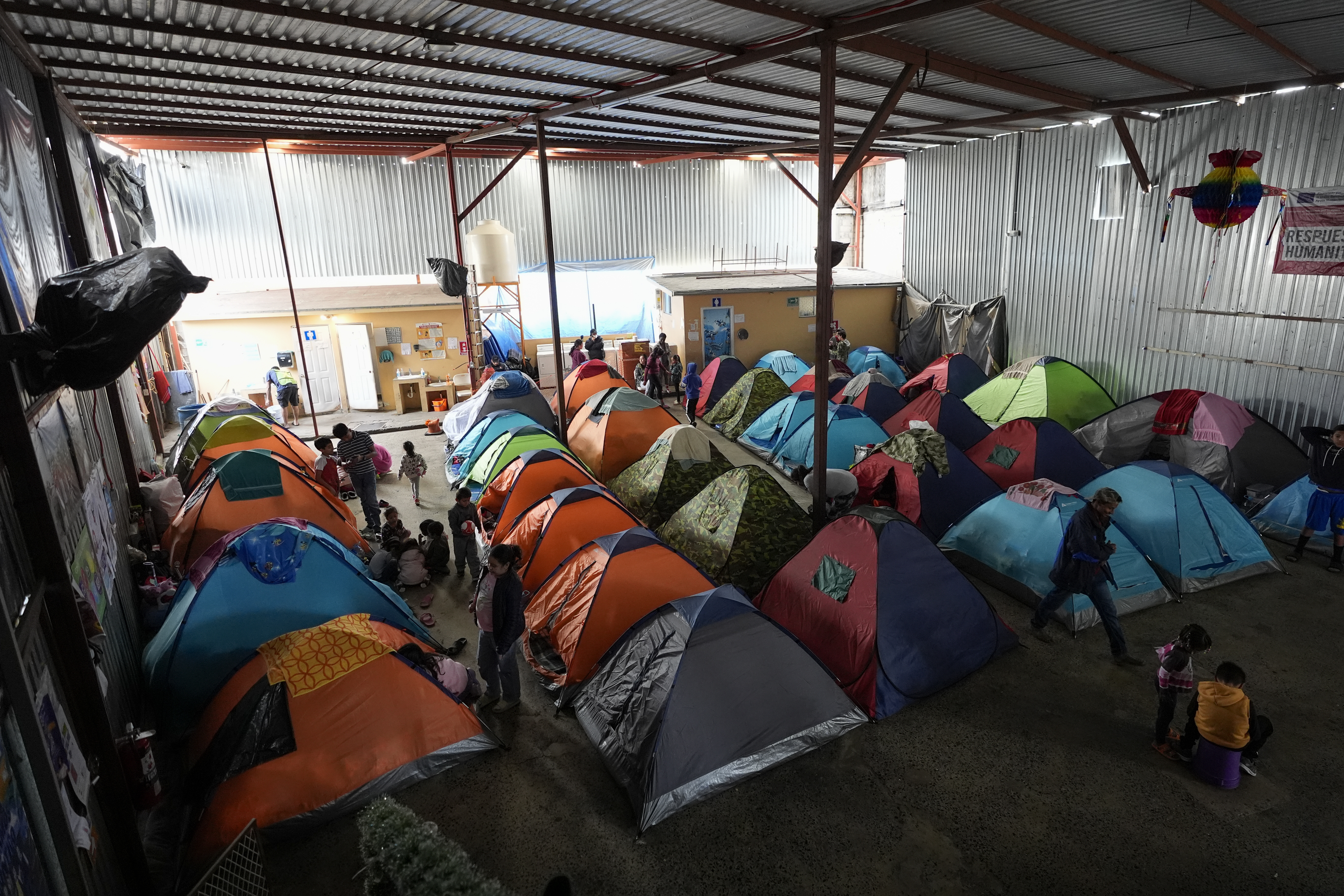 Asylum seekers wait for appointments through the CBP One app to apply for asylum in the United States in a shelter for migrants, Saturday, Feb. 3, 2024, in Tijuana, Mexico.<br />(Gregory Bull / AP Photo)