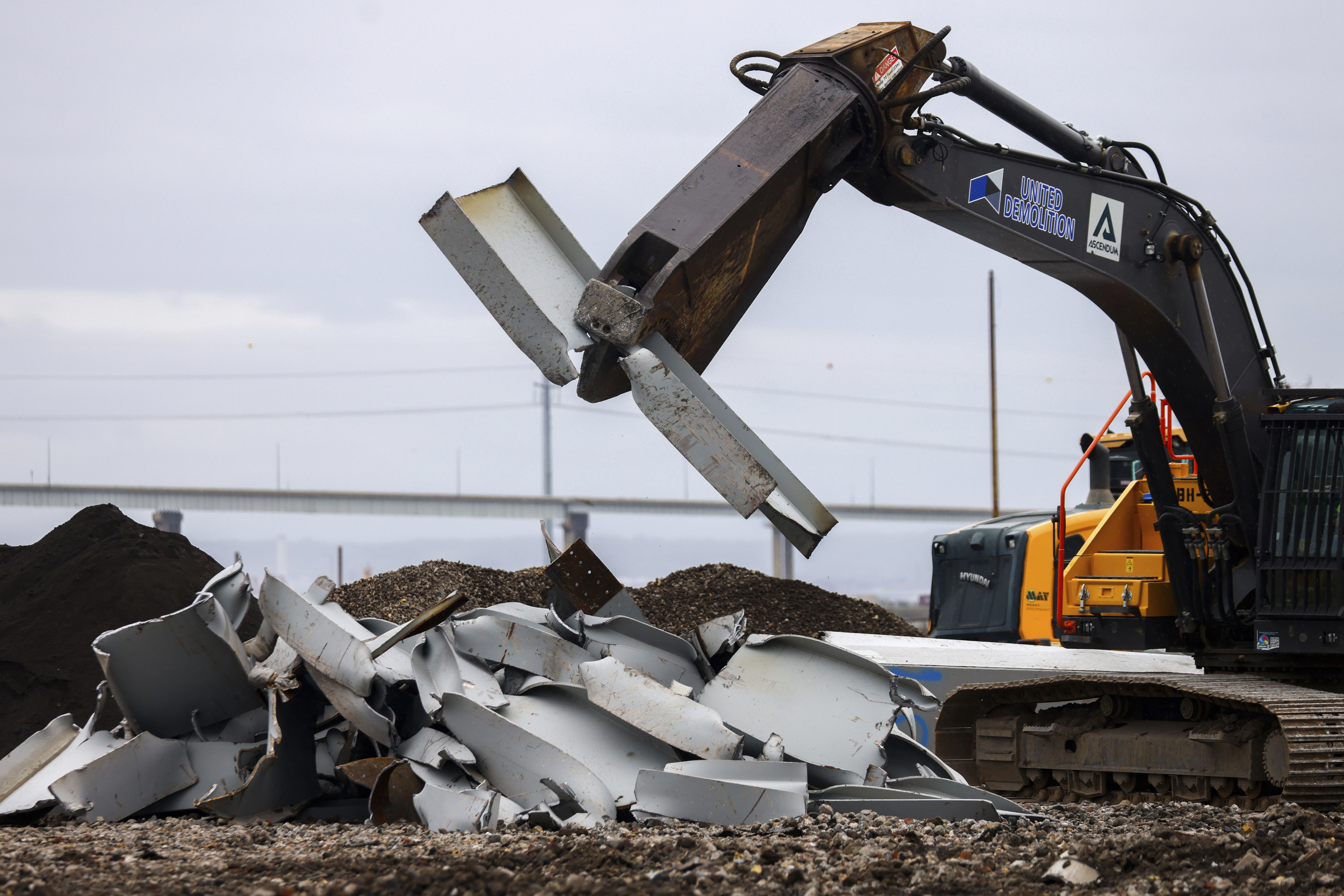 A shearer breaks apart salvaged pieces of the collapsed Francis Scott Key Bridge at Tradepoint Atlantic, Friday, April 12, 2024, in Sparrows Point, Md.<br /> (Julia Nikhinson / AP Photo)
