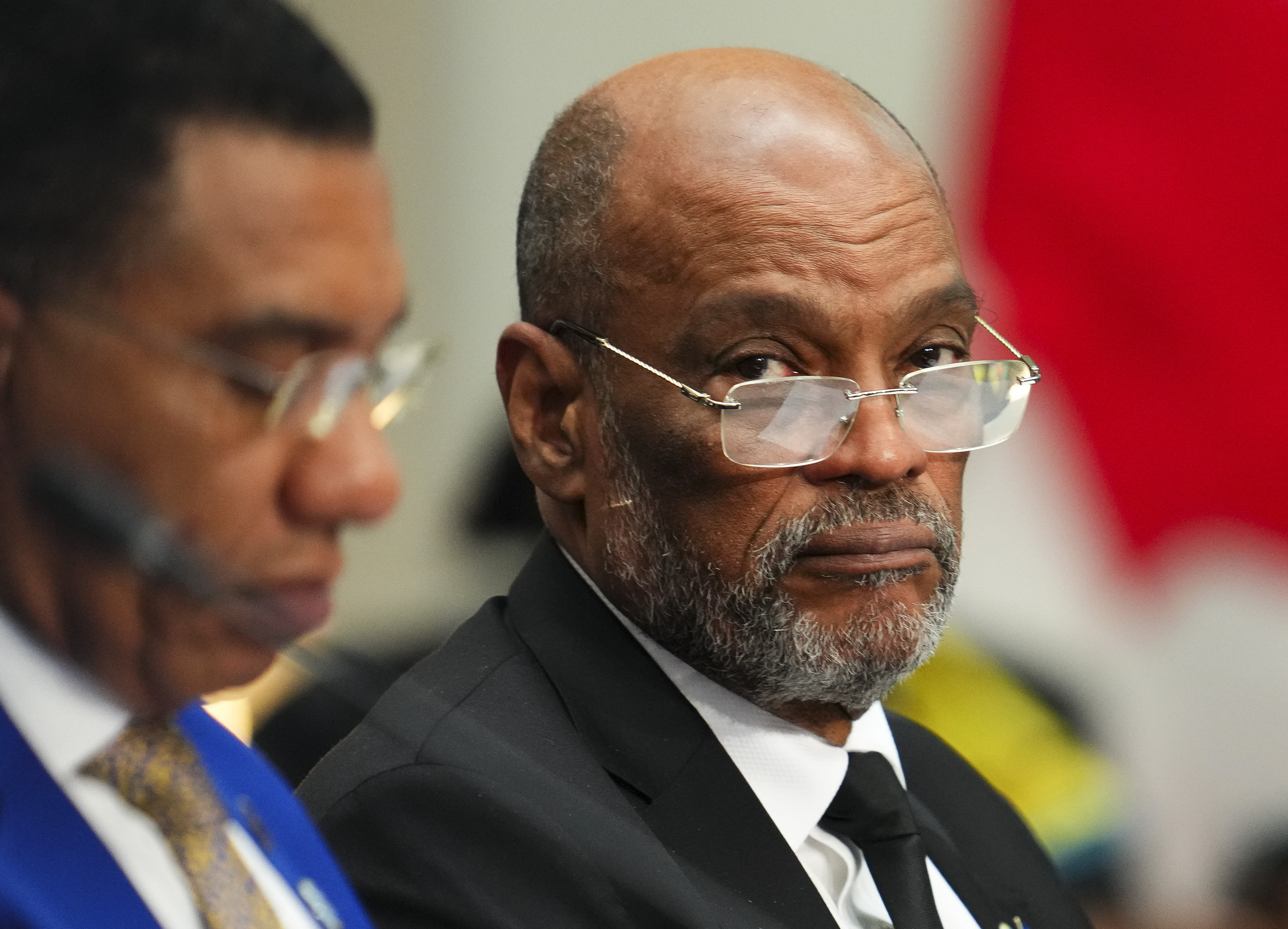 Haiti&#039;s Prime Minister Ariel Henry, right, attends a working session at the Canada-CARICOM Summit in Ottawa, Ontario, Oct. 18, 2023. Henry resigned on April 25, 2024, leaving the way clear for a new government to be formed in the Caribbean country.<br />(Sean Kilpatrick / The Canadian Press via AP)