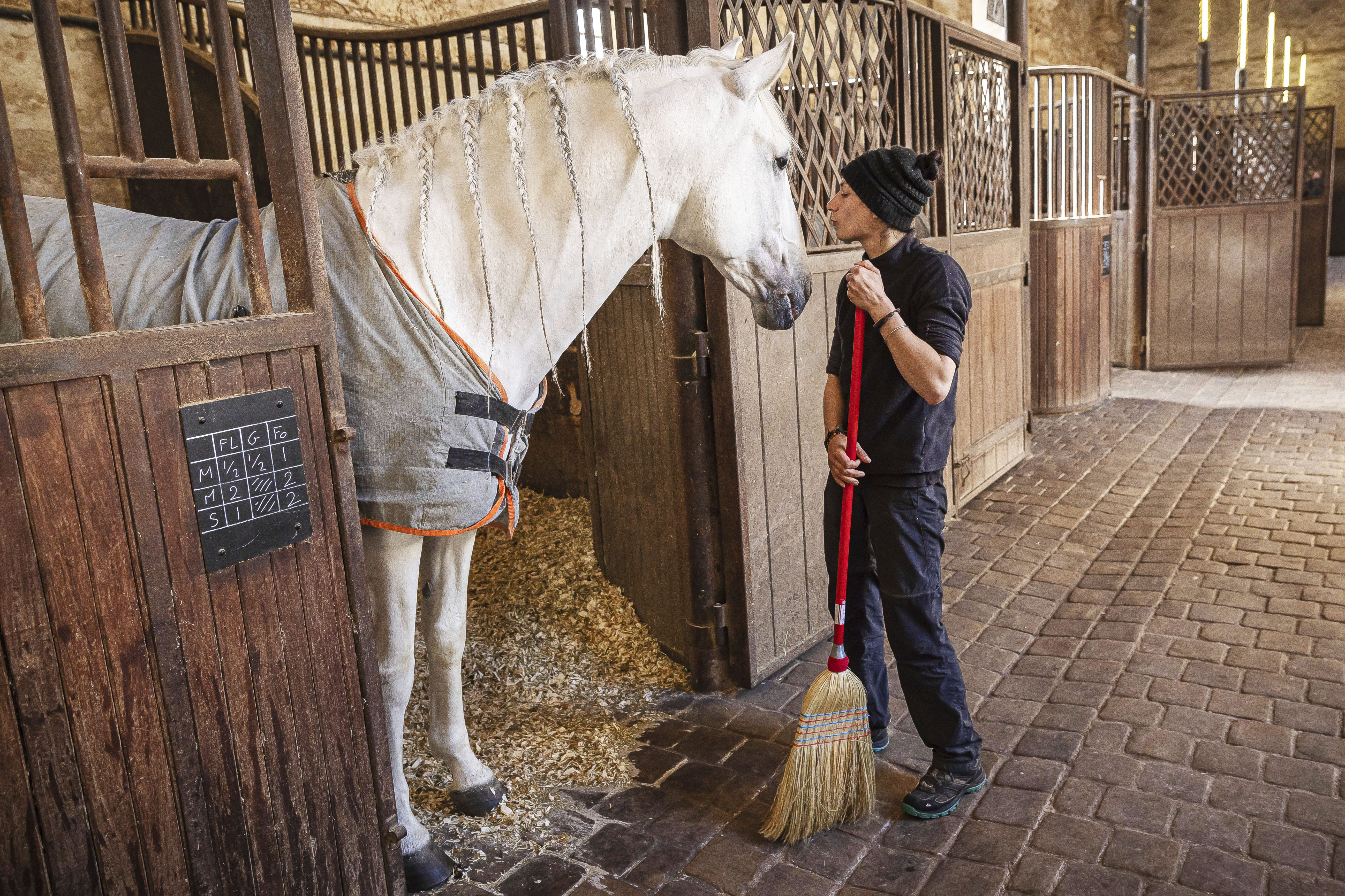A horsewoman cleans the royal stables, in Versailles.<br />(Aurelien Morissard / AP Photo)