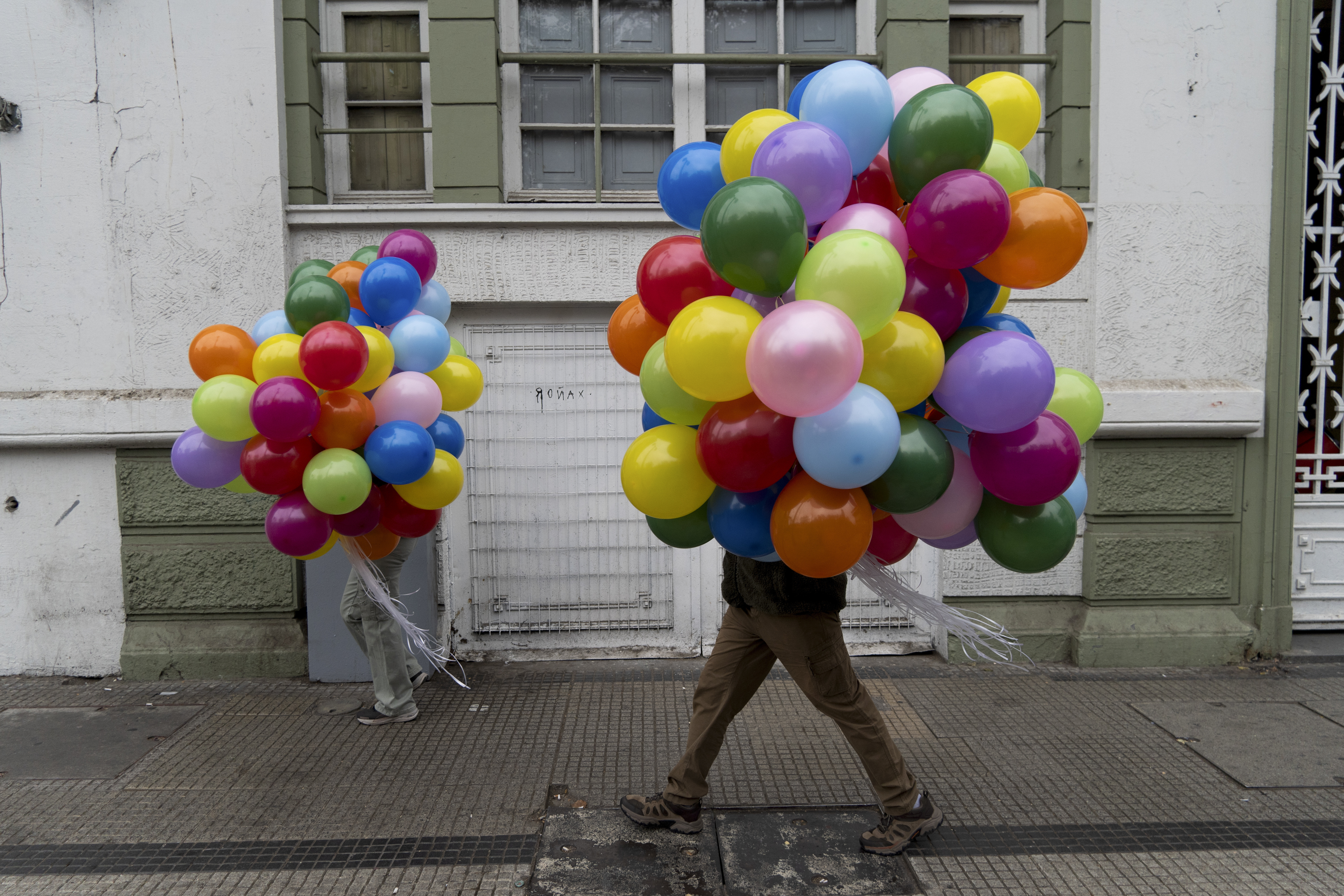 Protesters carry balloons to a march on International Workers’ Day in Santiago, Chile, Wednesday, May 1, 2024.<br />(Matias Basualdo / AP Photo)