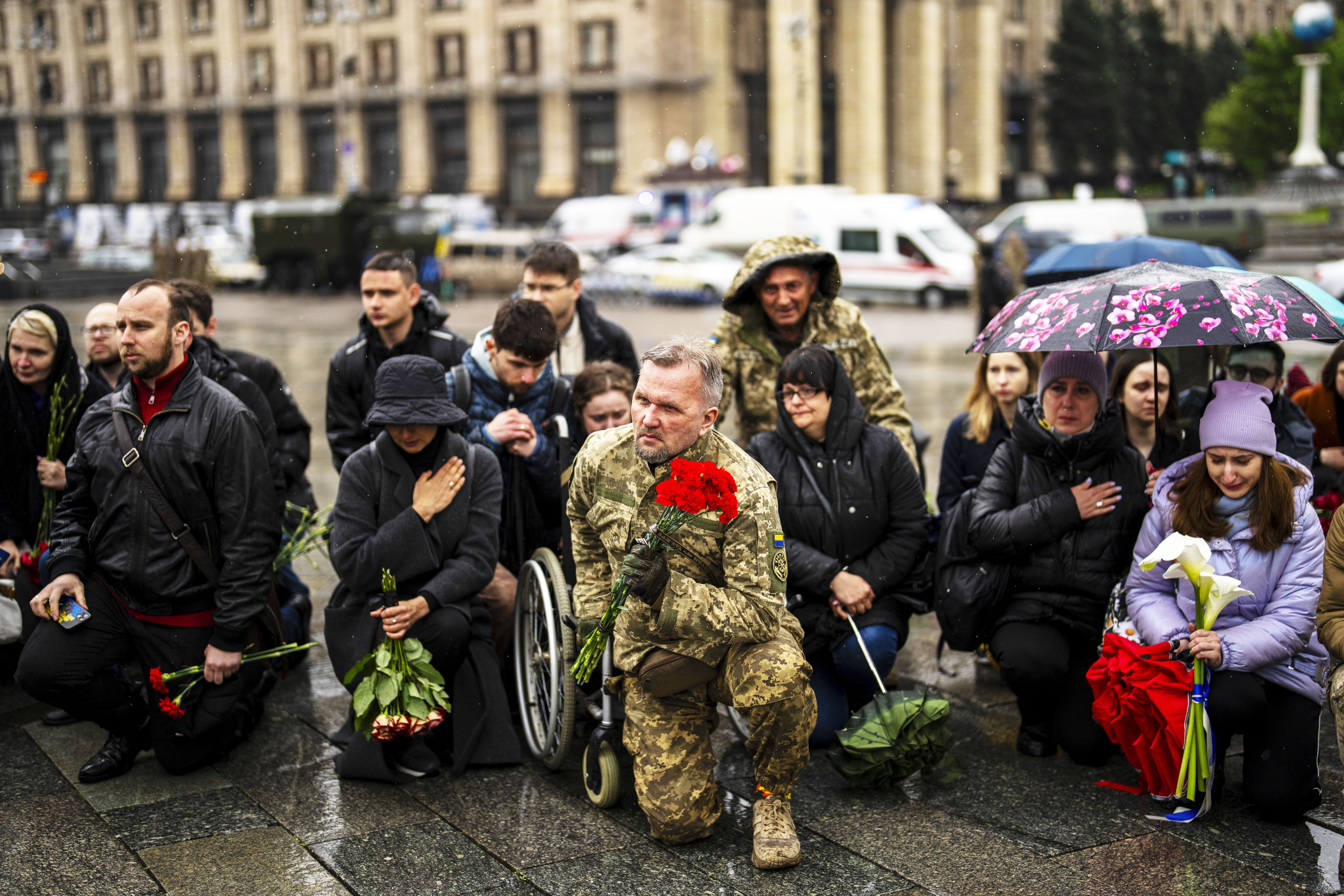 Family, friends and army comrades gather to pay respect to Ukrainian army paramedic Nazarii Lavrovskyi, 31, killed in the war, during his funeral ceremony at Independence square in Kyiv, Wednesday, April 24, 2024.<br />(Francisco Seco / AP Photo)