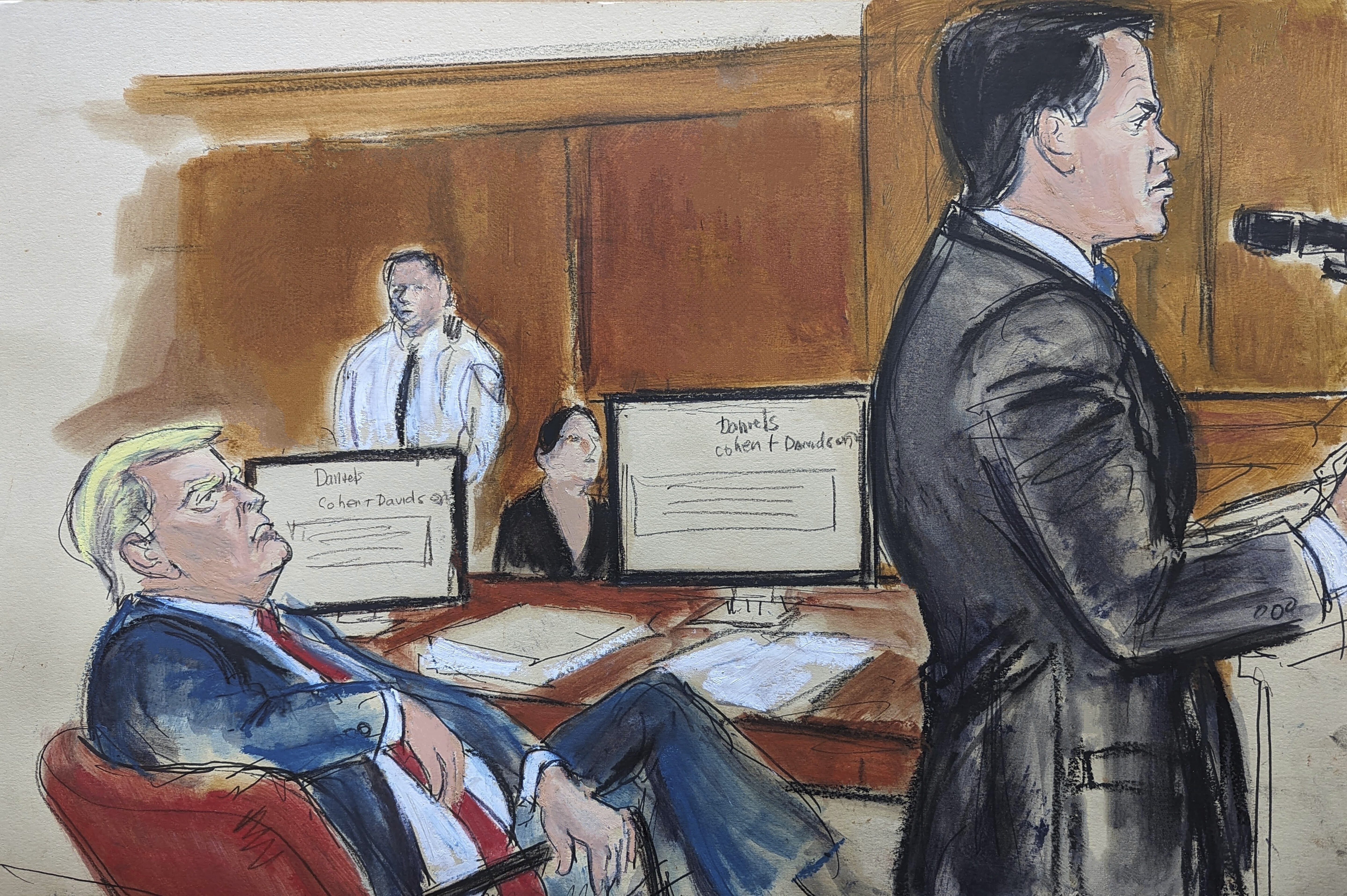 In this courtroom sketch, Tuesday, May 28, 2024, Donald Trump, seated left at the defense table, turns and looks at his attorney Todd Blanche during the defense summation, in New York.<br /> (Elizabeth Williams via AP)