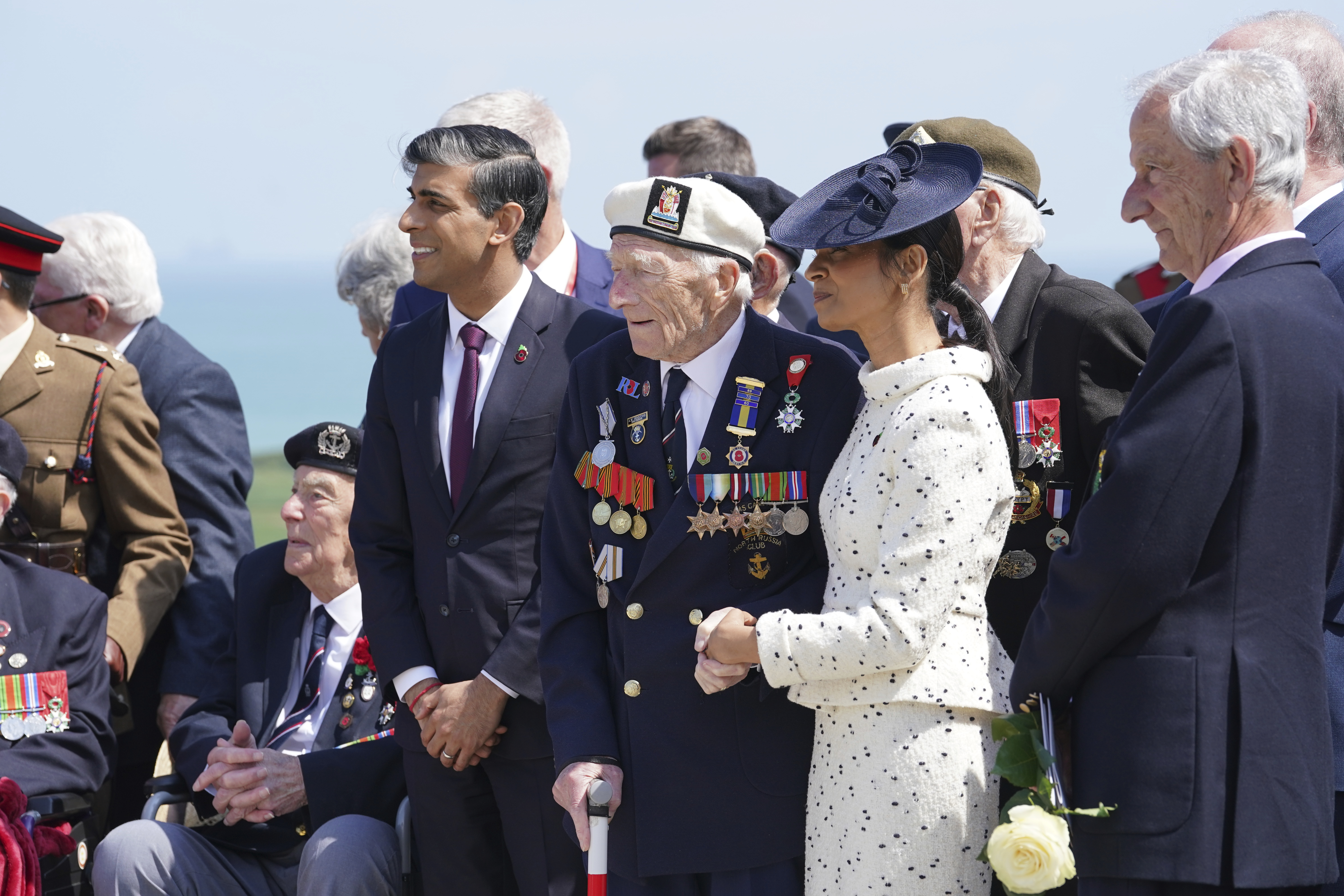 Prime Minister Rishi Sunak and Akshata Murty stand with D-Day veteran Alec Penstone, 98, following the UK national commemorative event for the 80th anniversary of D-Day, held at the British Normandy Memorial in Ver-sur-Mer, Normandy, France, Thursday June 6, 2024.<br />(Gareth Fuller / AP Photo)