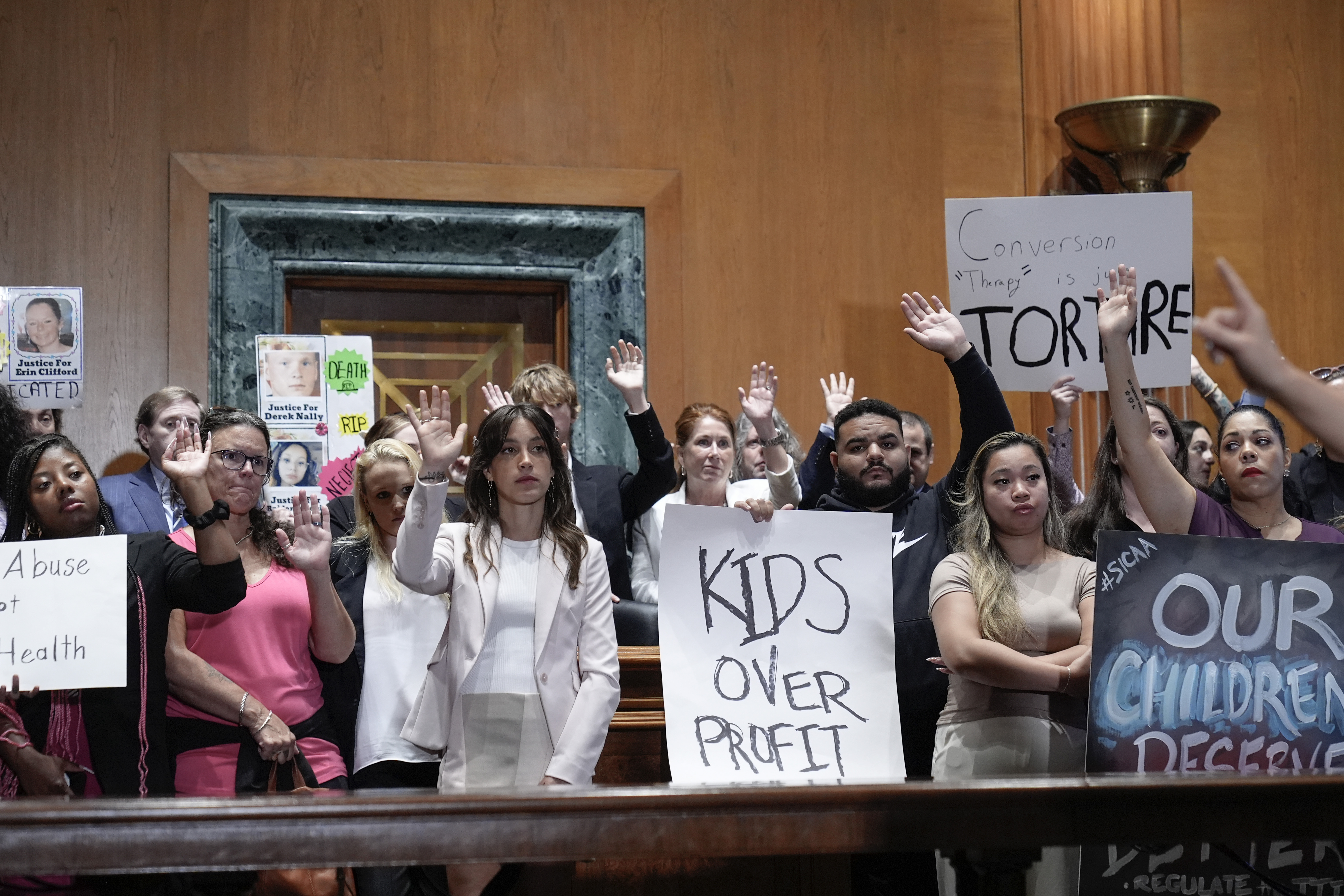 Victims and survivors of abused and neglected youth at residential treatment facilities (RTFs) and advocates, hold a news conference on the need for Congress to act to protect children and reform RTFs, Wednesday, June 12, 2024, on Capitol Hill in Washington.<br />(Mariam Zuhaib / AP Photo)