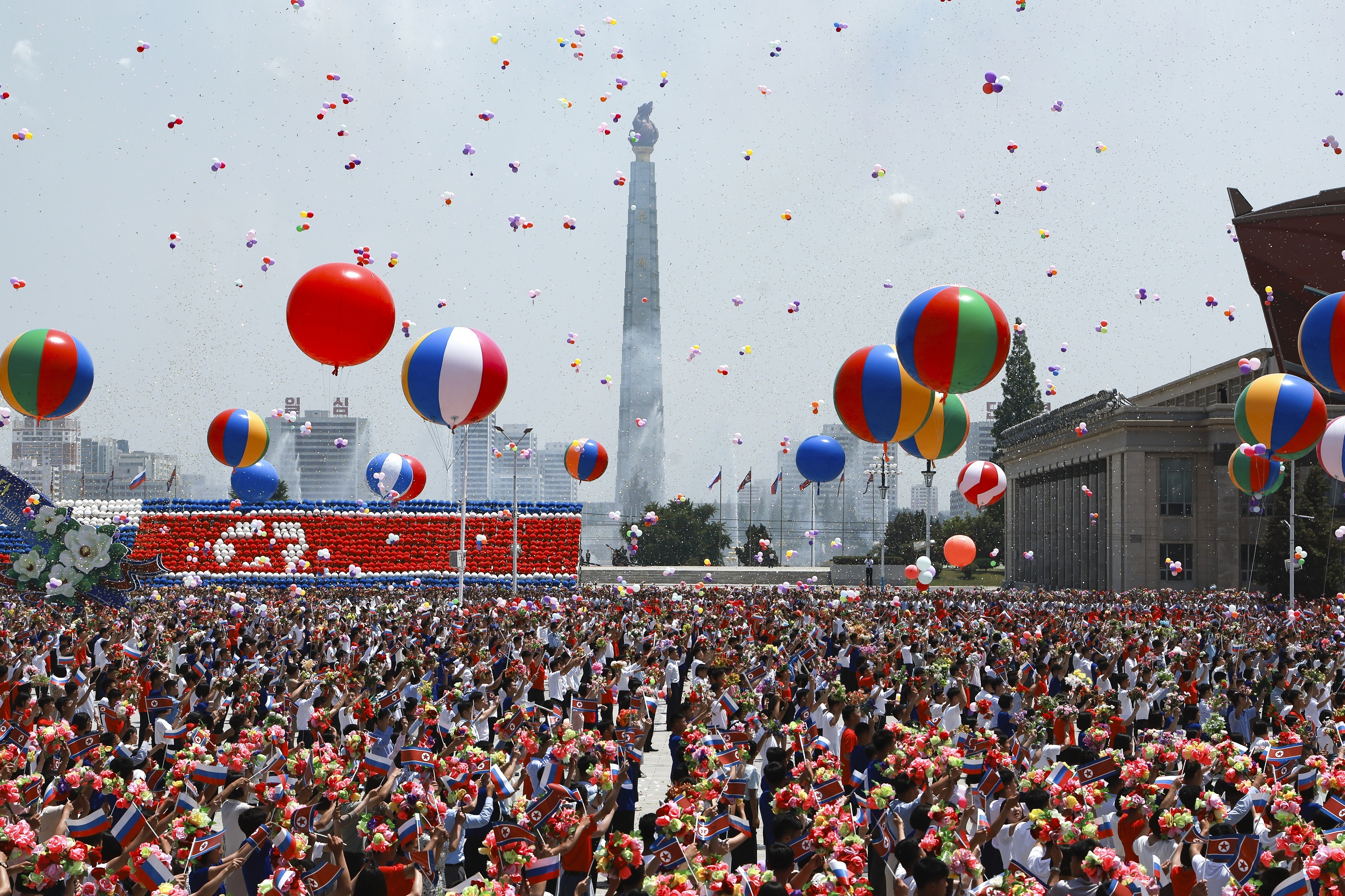 North Korea&#039;s people attend the official welcome ceremony with Russian President Vladimir Putin and North Korea&#039;s leader Kim Jong Un in the Kim Il Sung Square in Pyongyang, North Korea, on Wednesday, June 19, 2024.<br />(Vladimir Smirnov / Sputnik / Kremlin Pool Photo via AP)