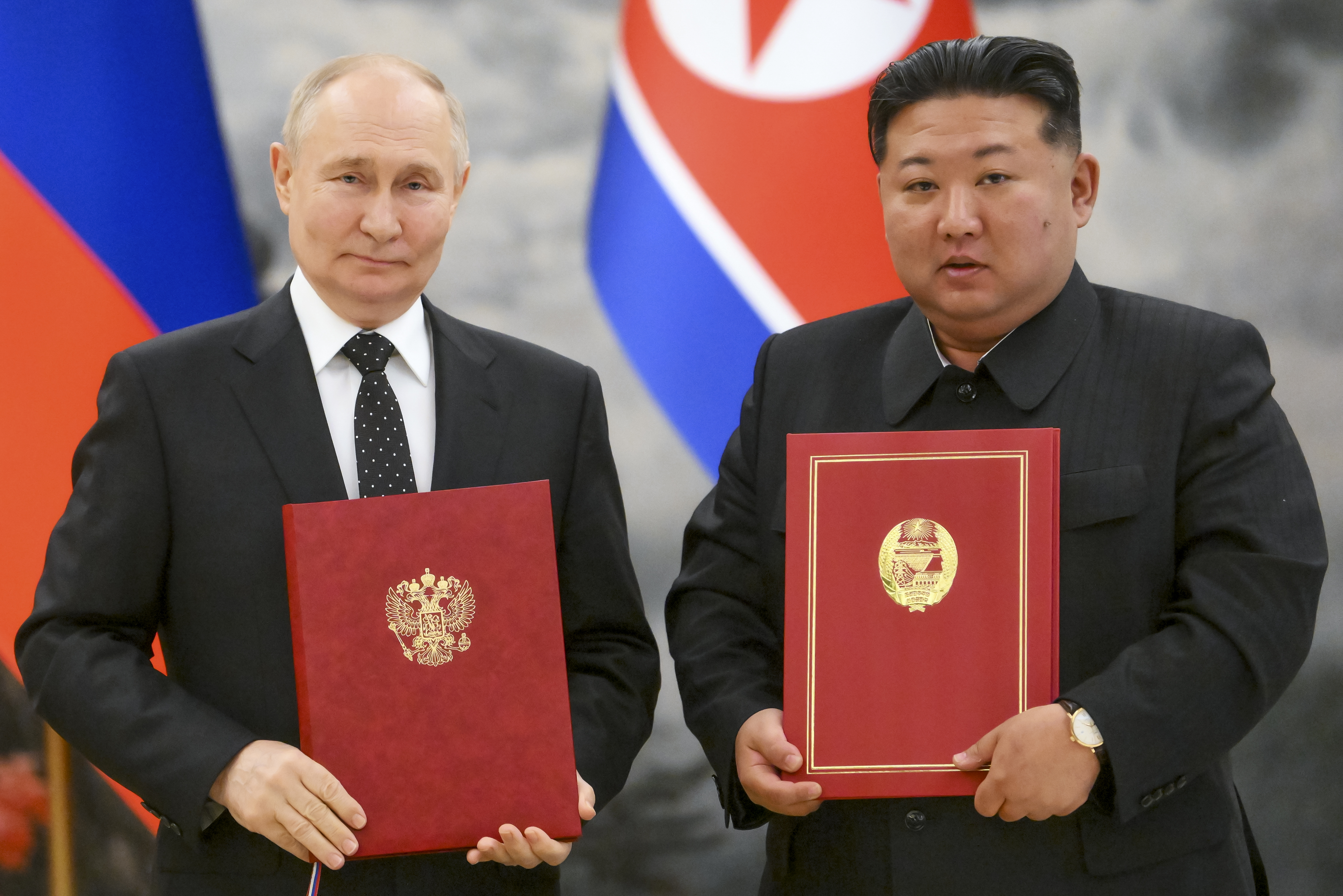 Russian President Vladimir Putin (left) and North Korea&#039;s leader Kim Jong Un pose for a photo during a signing ceremony of the new partnership in Pyongyang, North Korea, on Wednesday, June 19, 2024.<br />(Kristina Kormilitsyna / Sputnik / Kremlin Pool Photo via AP)