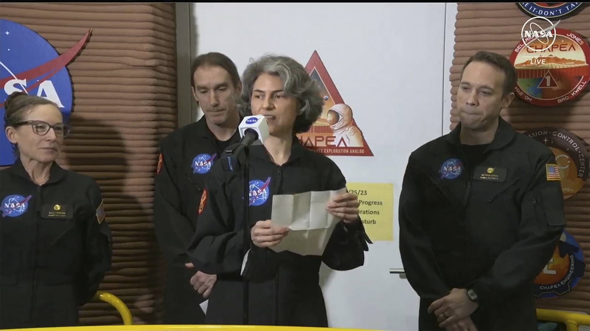 In this image made from video provided by NASA, Anca Selariu speaks in front of other members at Johnson Space Center in Houston, Texas.<br />(NASA via AP)