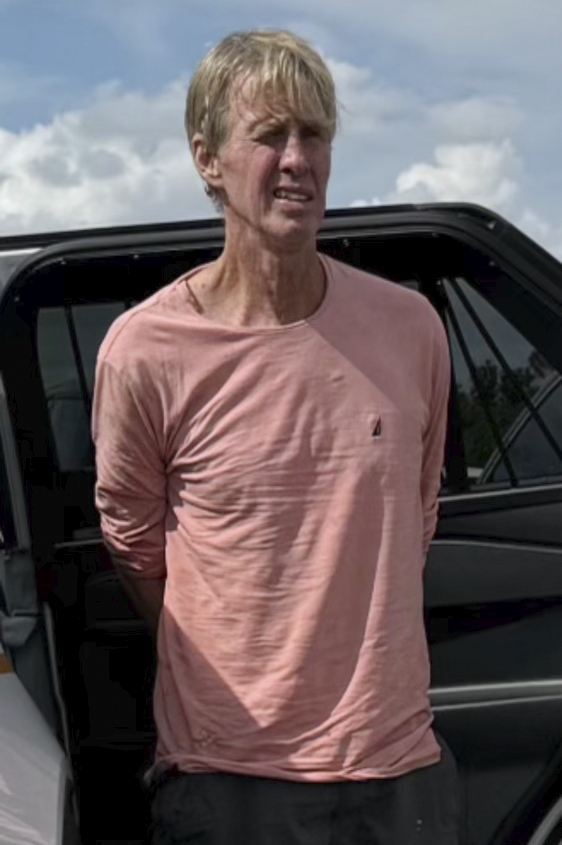 In this imaged released by the Martin County, Fla., Sheriff’s Office, law enforcement officers arrest Ryan Routh, the man suspected in the apparent assassination attempt of Donald Trump, Sunday, Sept. 15, 2024.<br /> (Martin County Sheriff’s Office via AP)