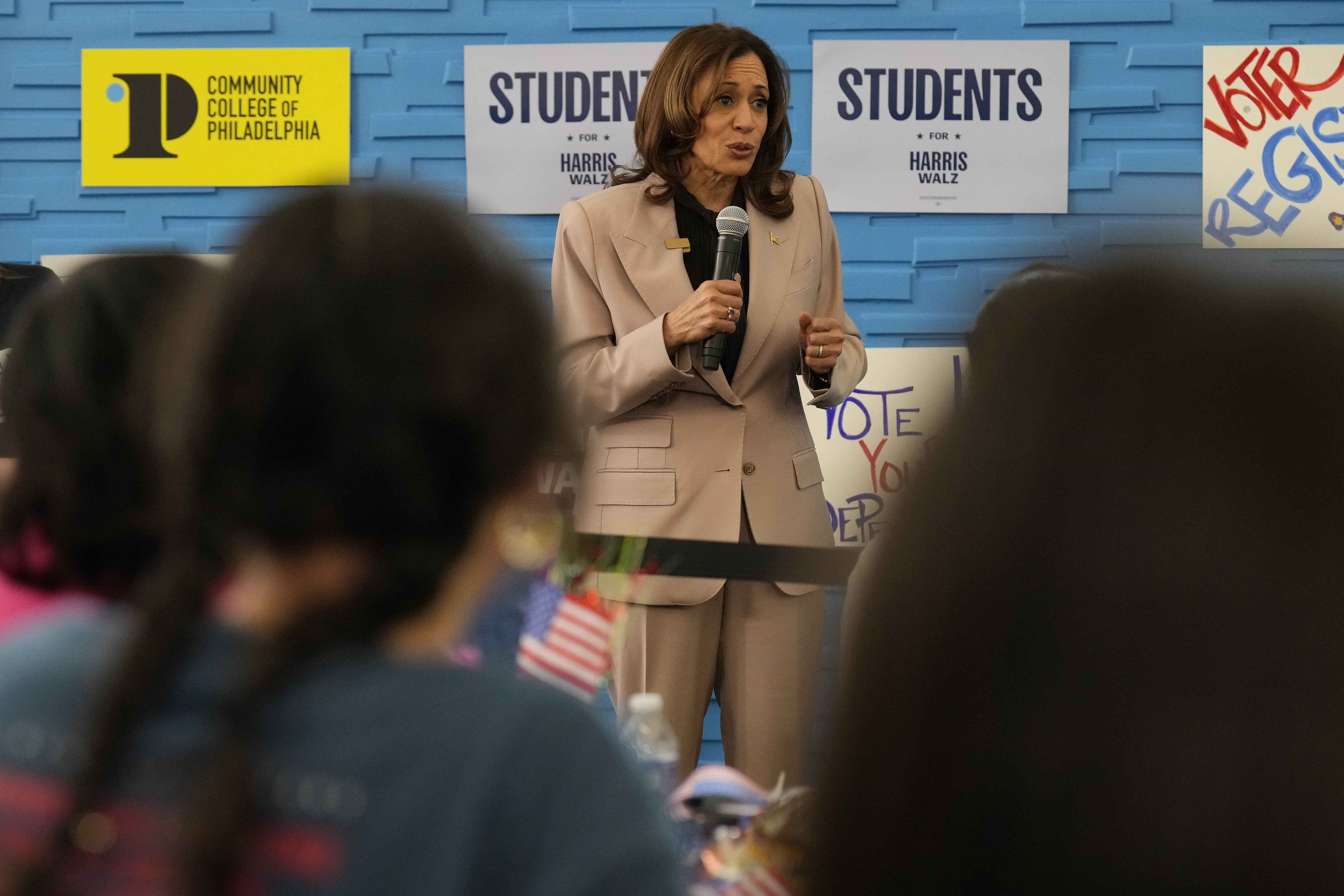 Democratic presidential nominee, Vice President Kamala Harris (center) speaking during an unscheduled stop to talk to student volunteers at Community College of Philadelphia, Tuesday, Sept. 17, 2024, in Philadelphia.<br /> (Jacquelyn Martin / AP Photo)