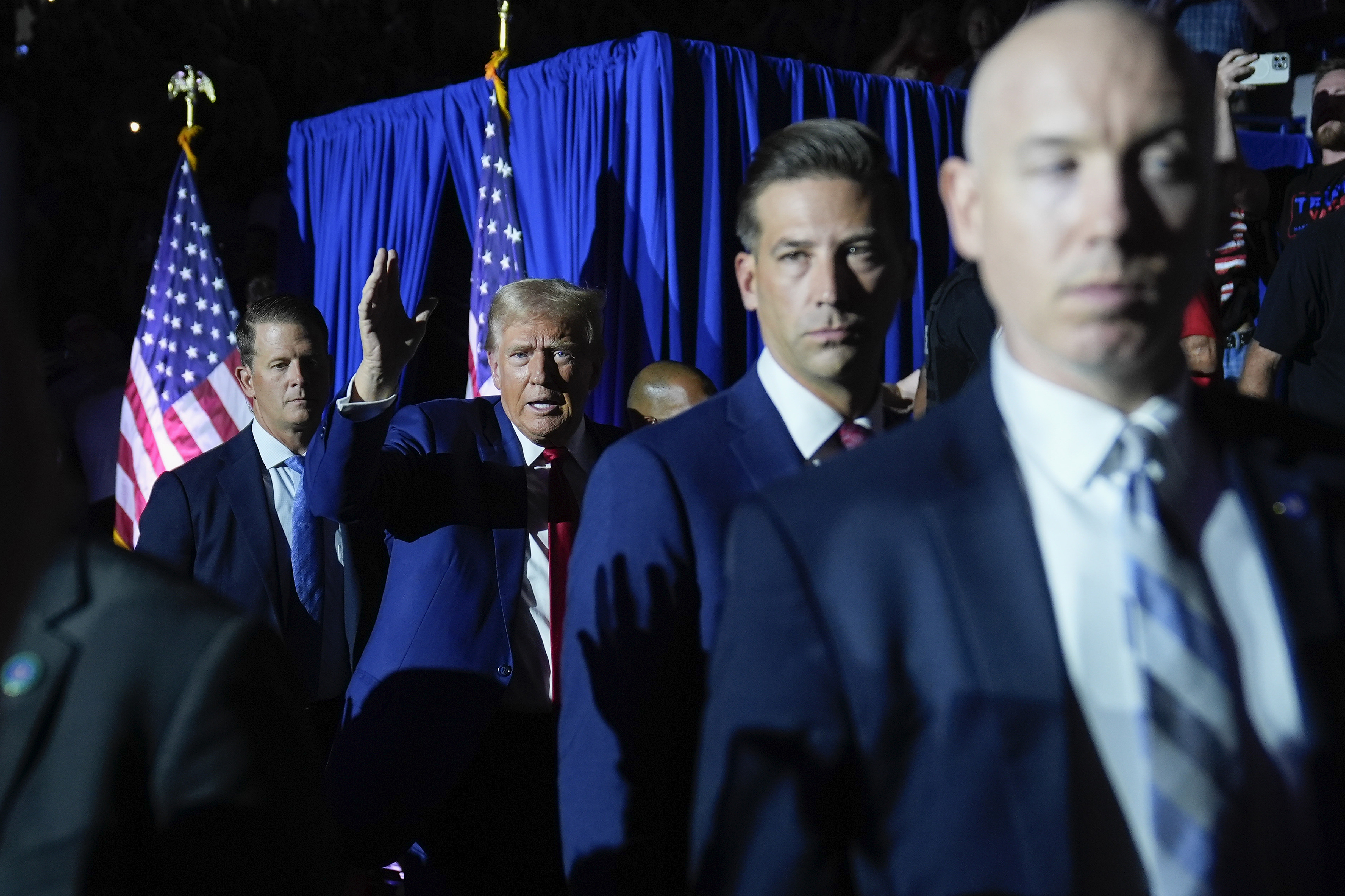 Republican presidential candidate former President Donald Trump (center) gestures as he is introduced for a town hall event at the Dort Financial Center, Tuesday, Sept. 17, 2024, in Flint, Mich.<br />(Evan Vucci / AP Photo)