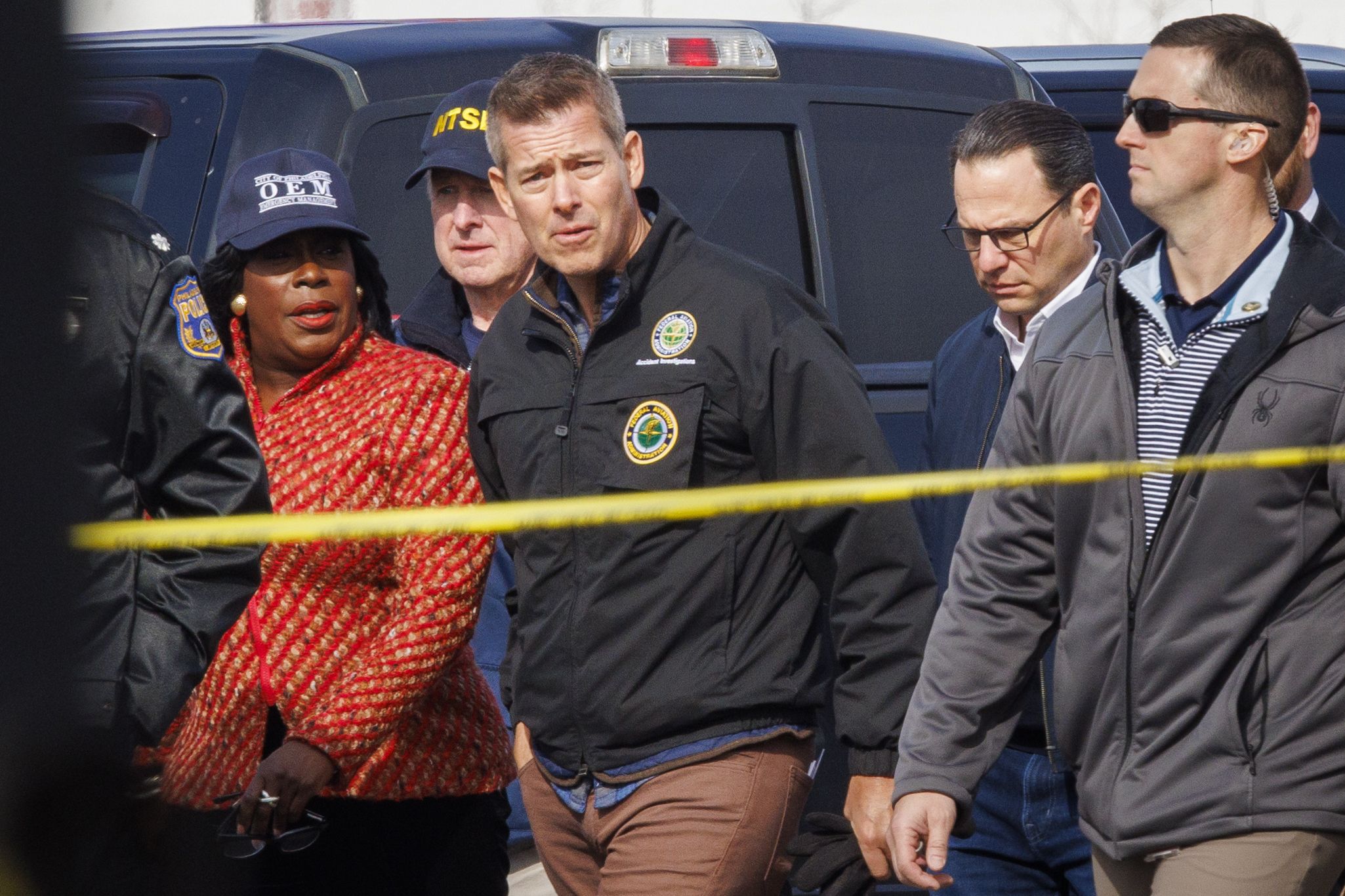 From left: Philadelphia Mayor Cherelle Parker, United States Secretary of Transportation Sean Patrick Duffy, and Pennsylvania Governor Josh Shapiro tour the Friday night crash scene of a medical transport jet Monday morning Feb. 3, 2025, in Philadelphia.<br />(Alejandro A. Alvarez / The Philadelphia Inquirer via AP)