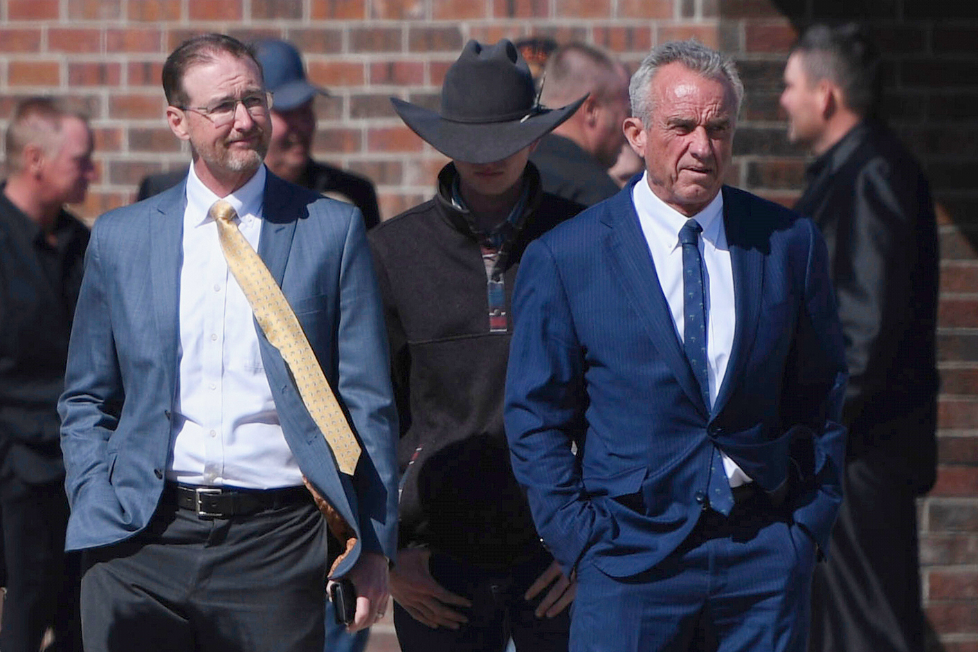 Health and Human Services Secretary Robert F. Kennedy Jr. (right) stands with Dr. Ben Edwards (left) outside the Reinlander Mennonite Church in Seminole, Texas, on Sunday, April 6, 2025, after a second measles death.<br />(Annie Rice / AP Photo)