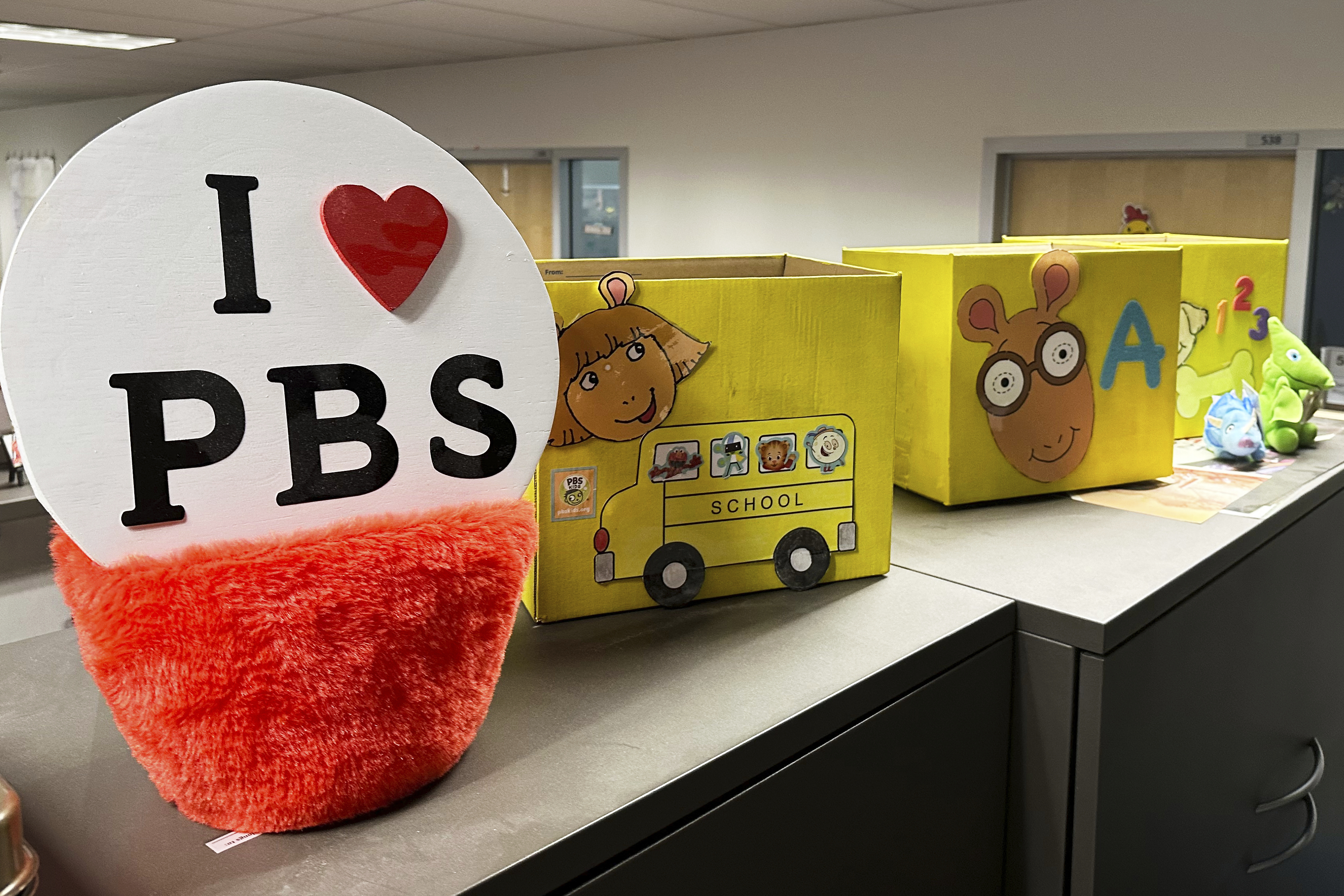 PBS Kids show characters including the title character from &quot;Arthur&quot; decorate boxes at the Arizona PBS offices in the Walter Cronkite School of Journalism and Mass Communication in Phoenix, Friday, May 2, 2025.<br />(Katie Oyan / AP Photo)