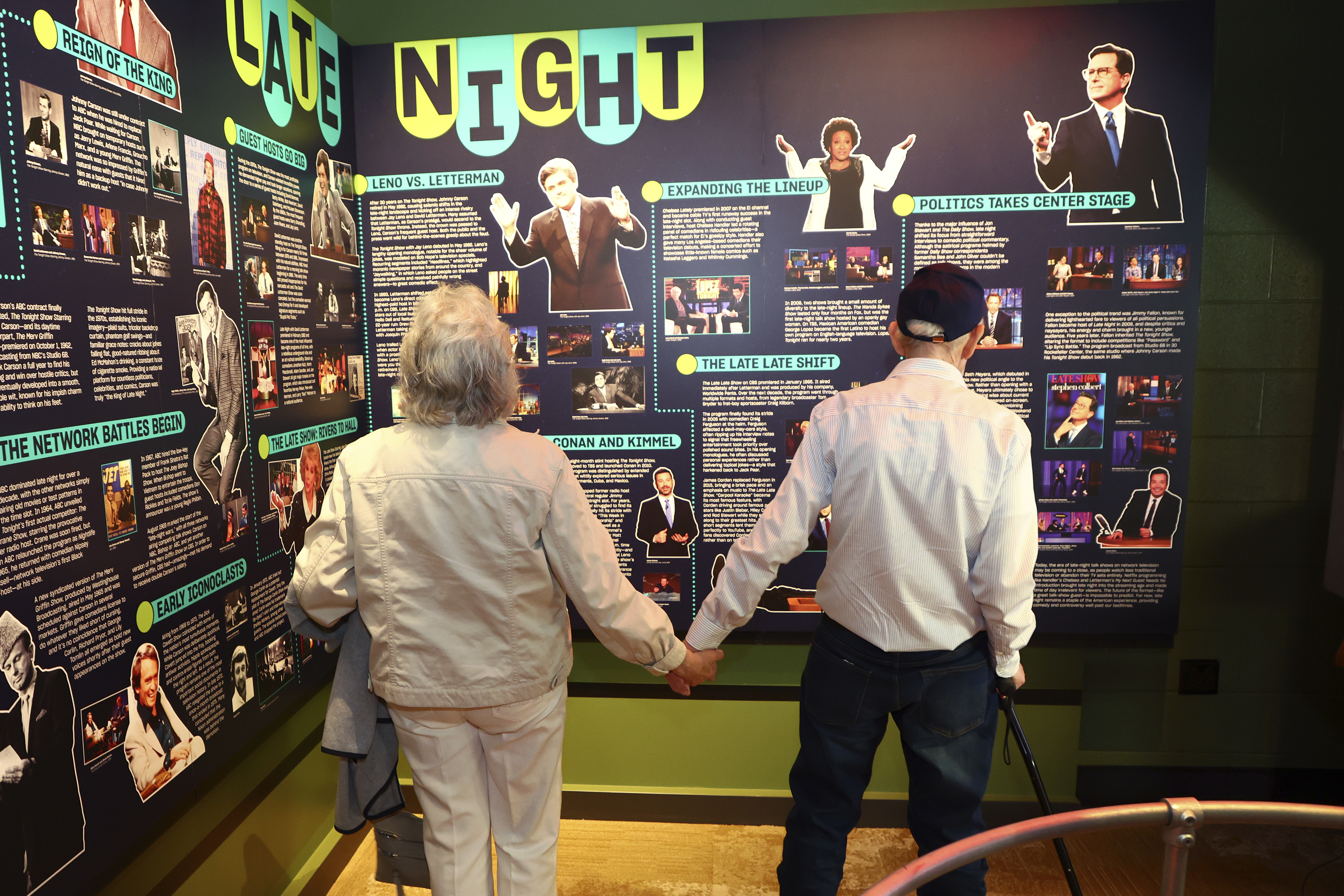 Mario and Gail Cirasunda, of Orchard Park, N.Y., look at exhibits from past and current comedy stars on display during a Memory Cafe event at the National Comedy Center Monday, May 5, 2025, in Jamestown, N.Y.<br />(Jeffrey T. Barnes / AP Photo)