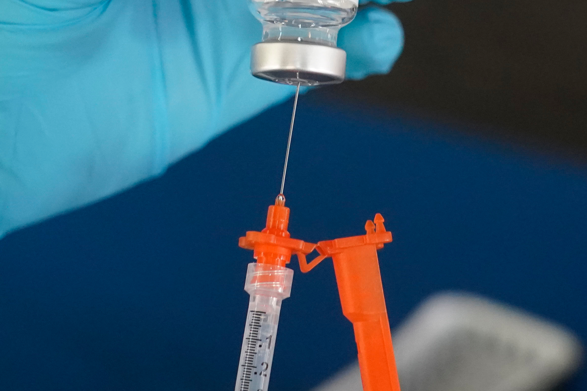 A nurse loads a syringe with a COVID-19 booster vaccine at an inoculation station in Jackson, Miss., Nov. 18, 2022.<br />(Rogelio V. Solis / AP Photo)