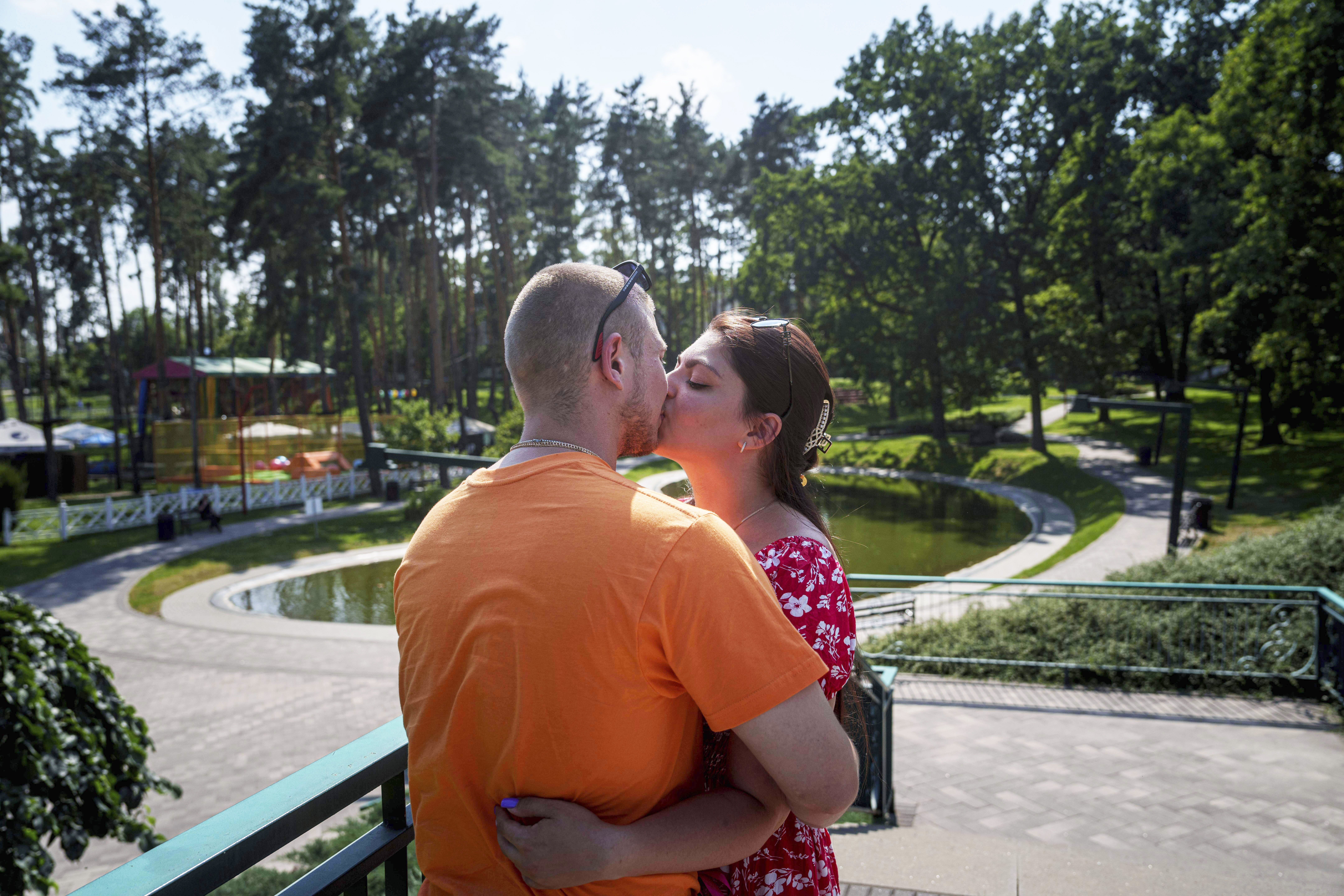 Ukrainian marine Stanislav Tarnavskyi kisses his girlfriend, Tetiana Baieva, in Irpin, Ukraine, Tuesday, July 8, 2025.<br />(Evgeniy Maloletka / AP Photo)