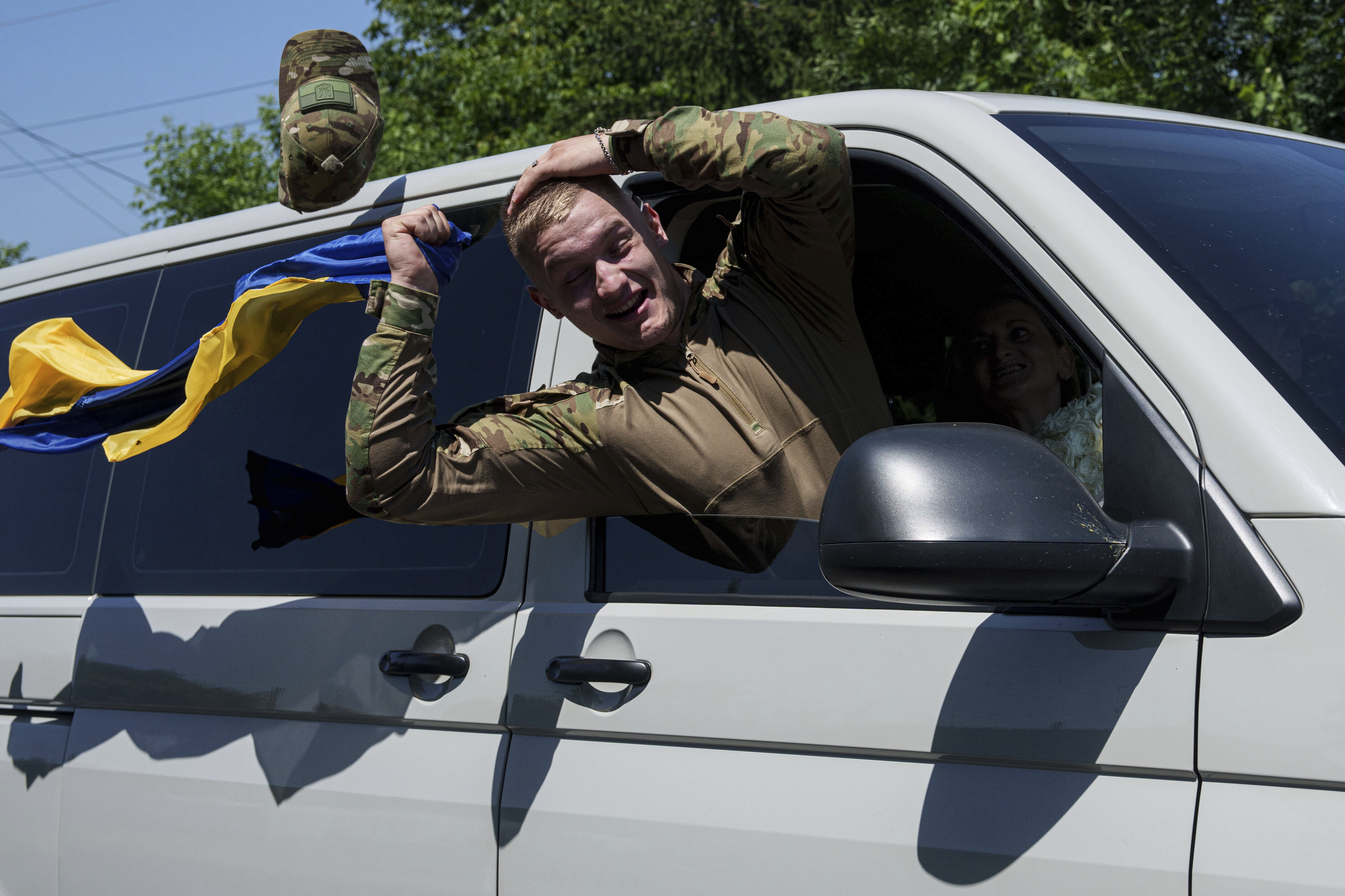 Ukrainian soldier Denys Zalizko, 21, greets his fellow villagers after returning from Russian captivity in Holovyno, Zhytomyr region, Ukraine, Monday, July 7, 2025.<br />(Evgeniy Maloletka / AP Photo)