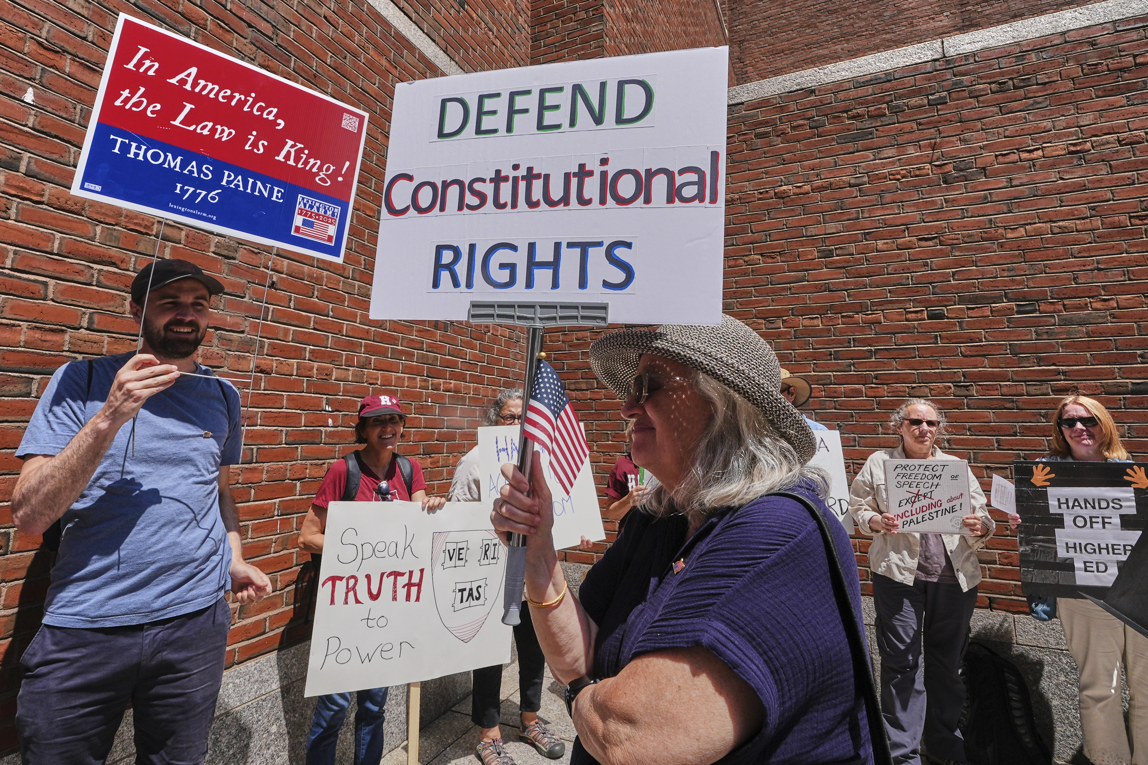 Protestors gather outside the Moakley Federal Courthouse, where Harvard University appeared to challenge $2.6 billion in funding cuts by the Trump administration, Monday, July 21, 2025, in Boston.<br />(Charles Krupa / AP Photo)