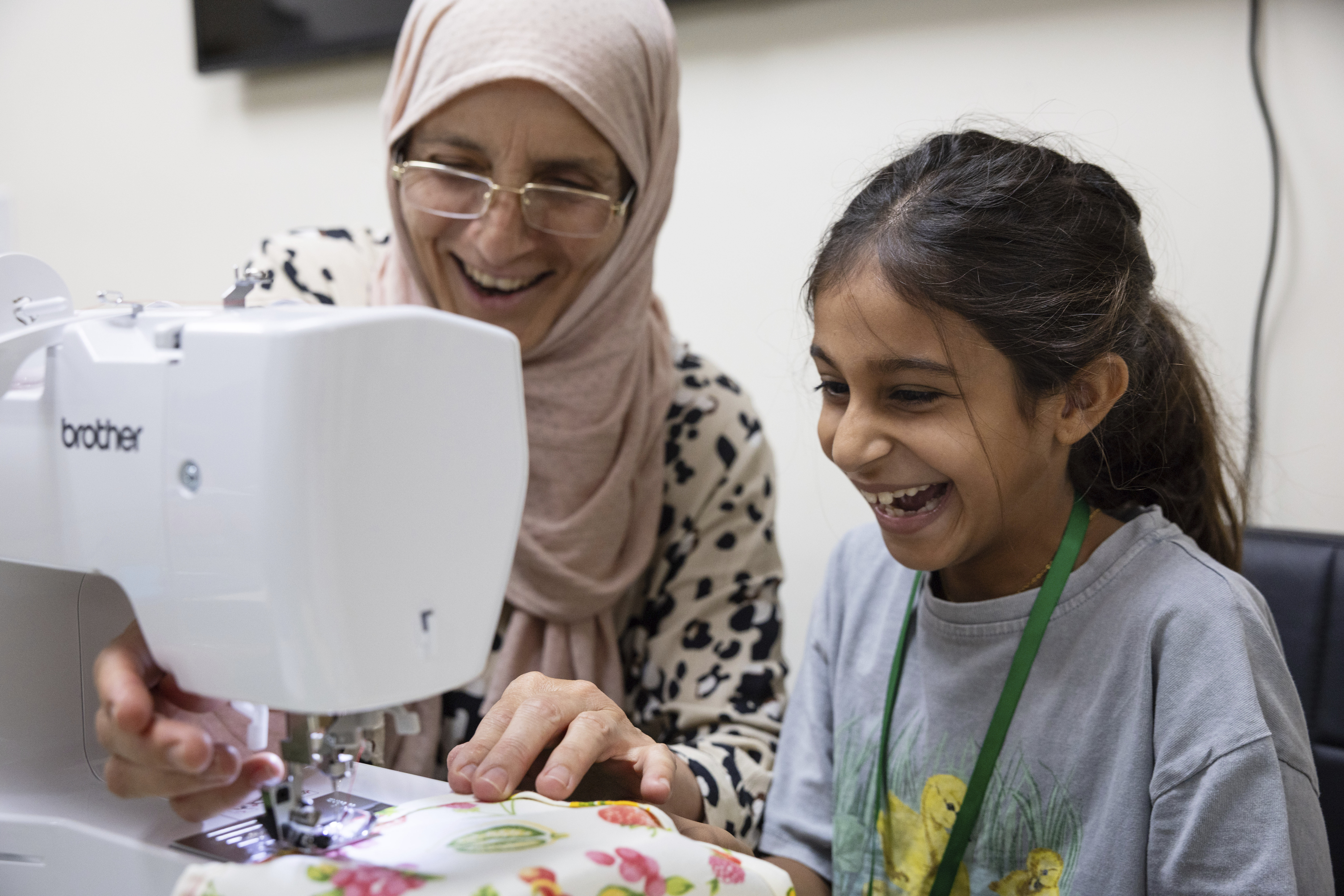Amal Alalim helps a student in a sewing class at Olive Community Services, Tuesday, July 29, 2025, in Fullerton, Calif. The class was part of the organization&#039;s Intergenerational Summer Camp.<br />(Zoë Meyers / AP Photo)