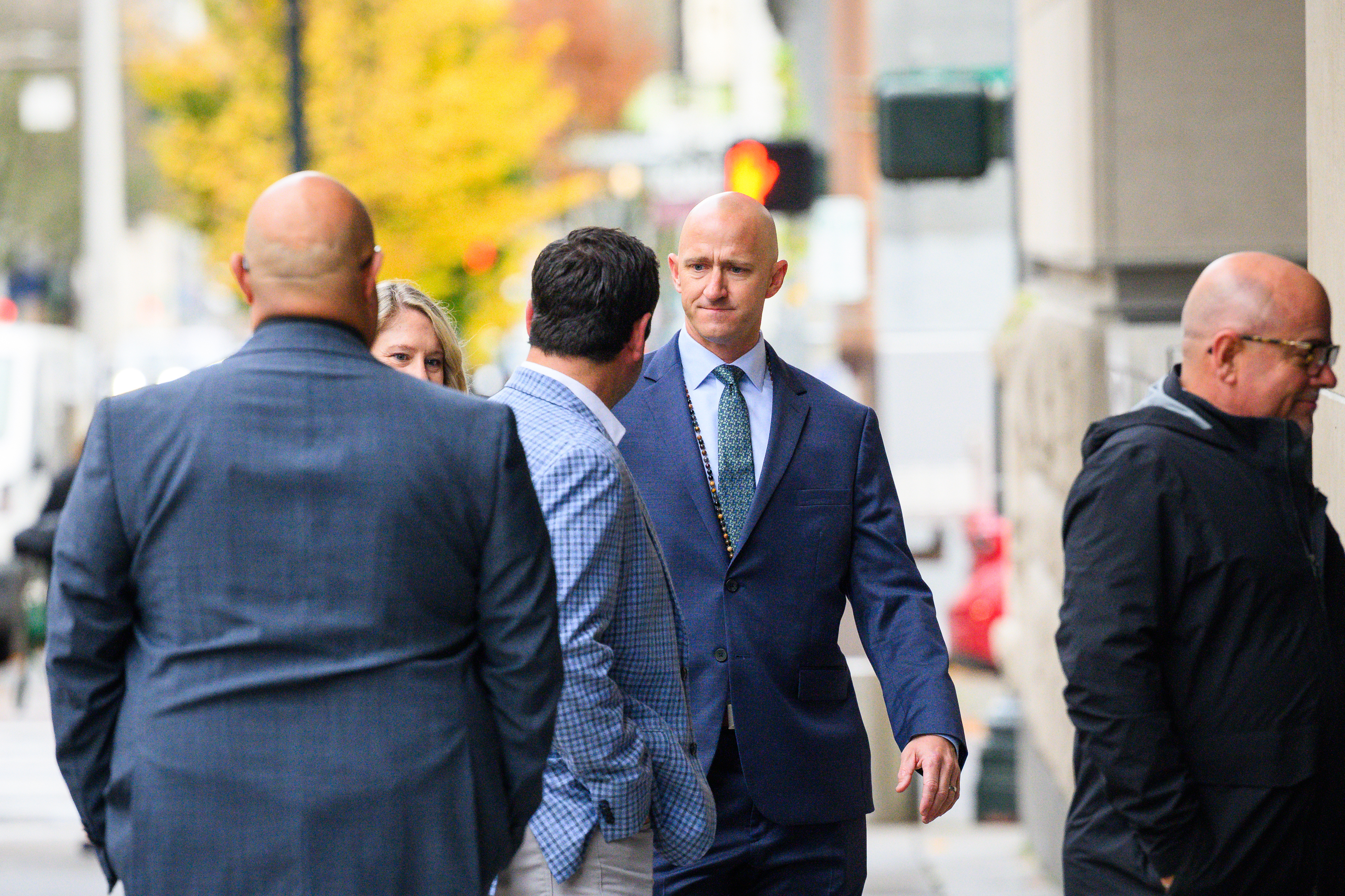 Former Alaska Airlines pilot Joseph Emerson (center) walks into U.S. District Court in Portland, Ore., Monday, Nov. 17, 2025.<br />(Molly J. Smith / AP Photo)