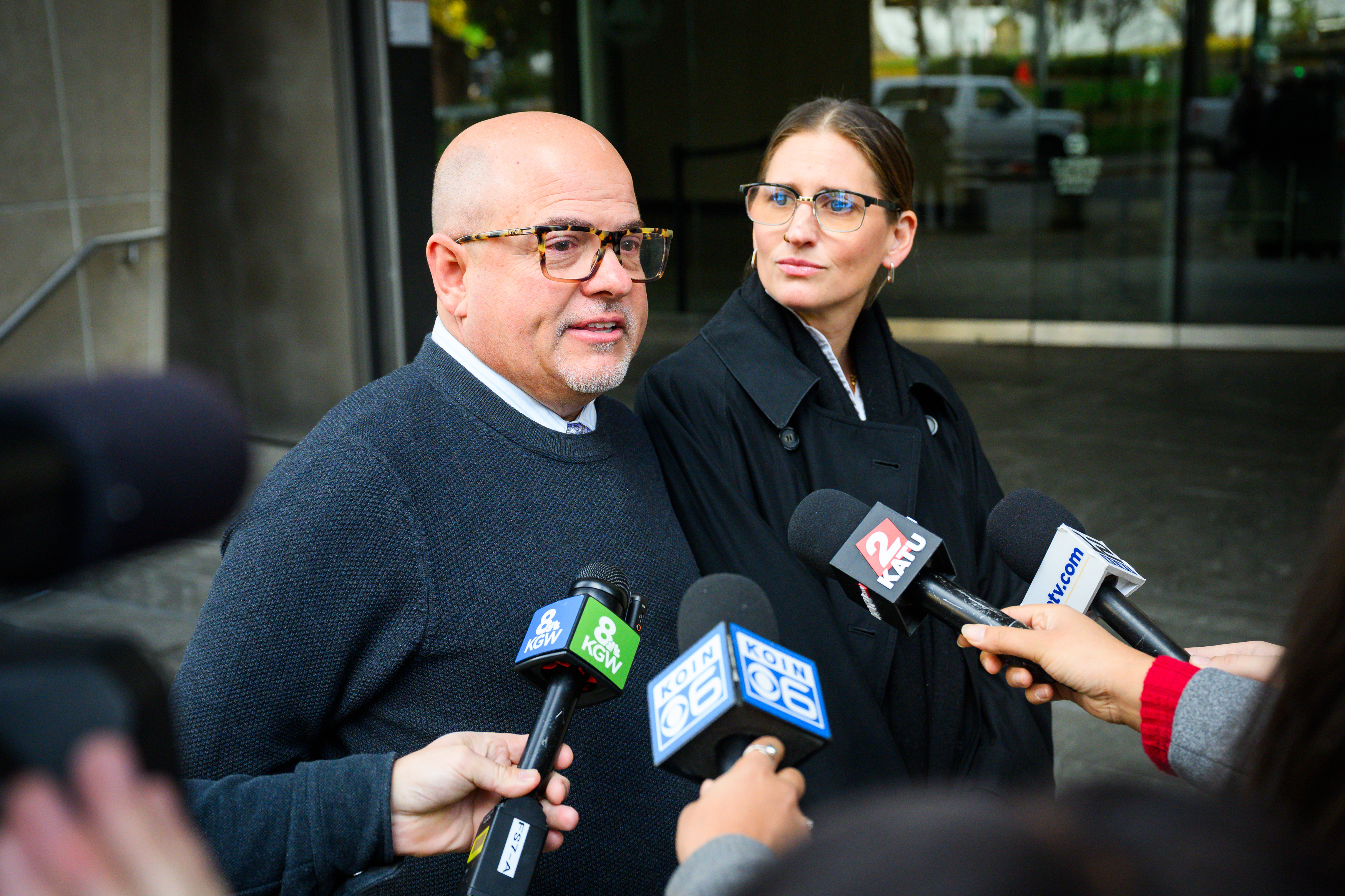 Mike Tacconi (left) and Carmen Loeffler (right) friends of former Alaska Airlines pilot Joseph Emerson, speak in support of Emerson following his sentencing at the U.S. District Court in Portland, Ore., Monday, Nov. 17, 2025.<br />(Molly J. Smith / AP Photo)