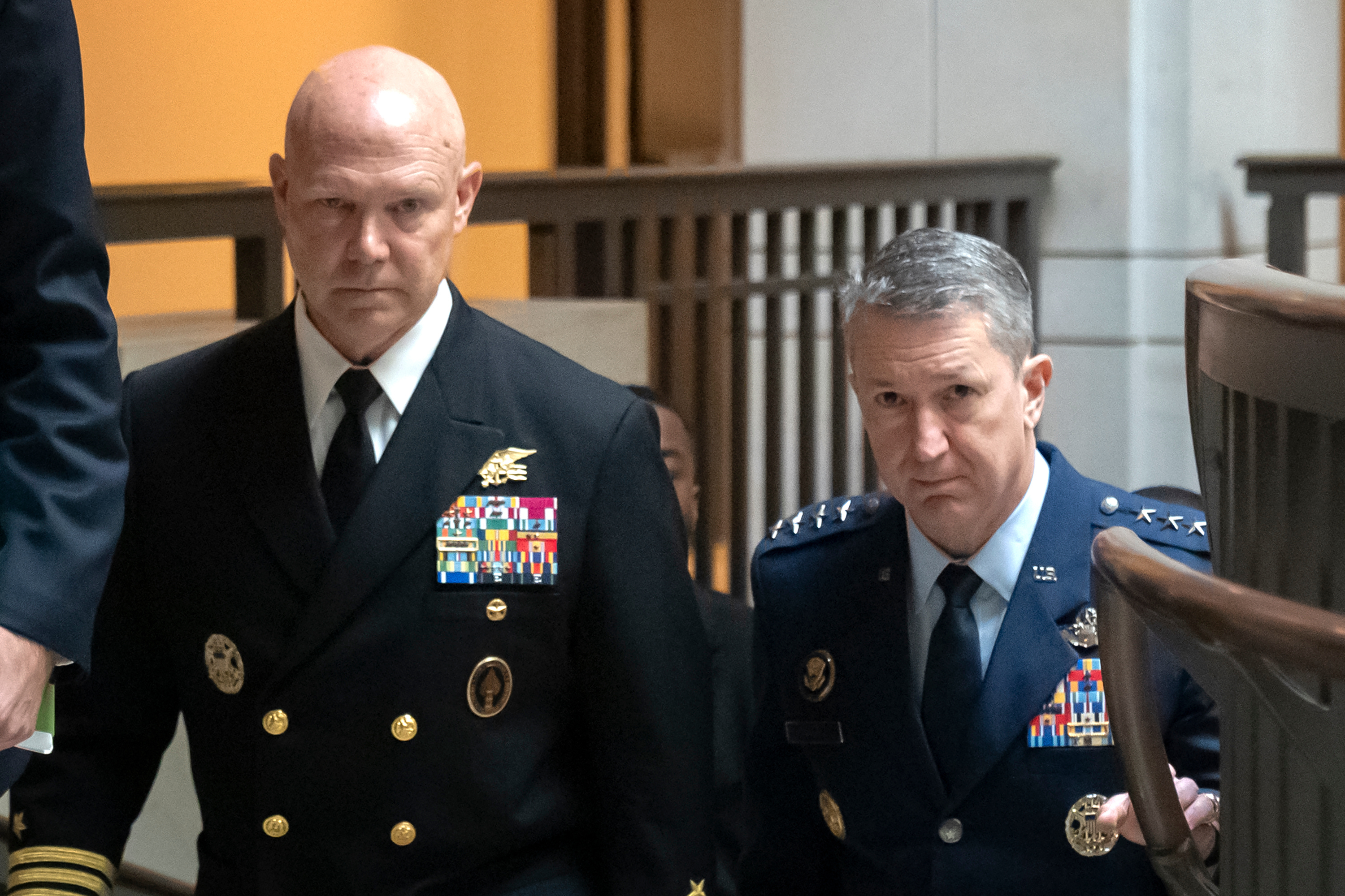 U.S. Navy Adm. Frank M. Bradley, accompanied by Gen. Dan Caine, chairman of the Joint Chiefs of Staff (right) walks to a meeting with senators on Capitol Hill, Thursday, Dec. 4, 2025, in Washington.<br />(Mark Schiefelbein / AP Photo)