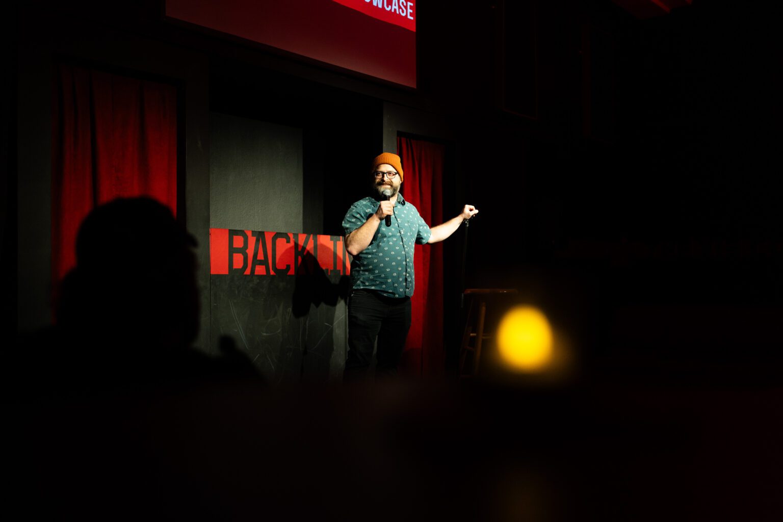 The Backline’s owner Dylan Rohde introduces the last act of a comedy showcase in late February. After starting The Backline in the basement of an art studio, Rohde moved The Backline to its current home on Harney Street.<br />(Joseph Saaid / Flatwater Free Press)