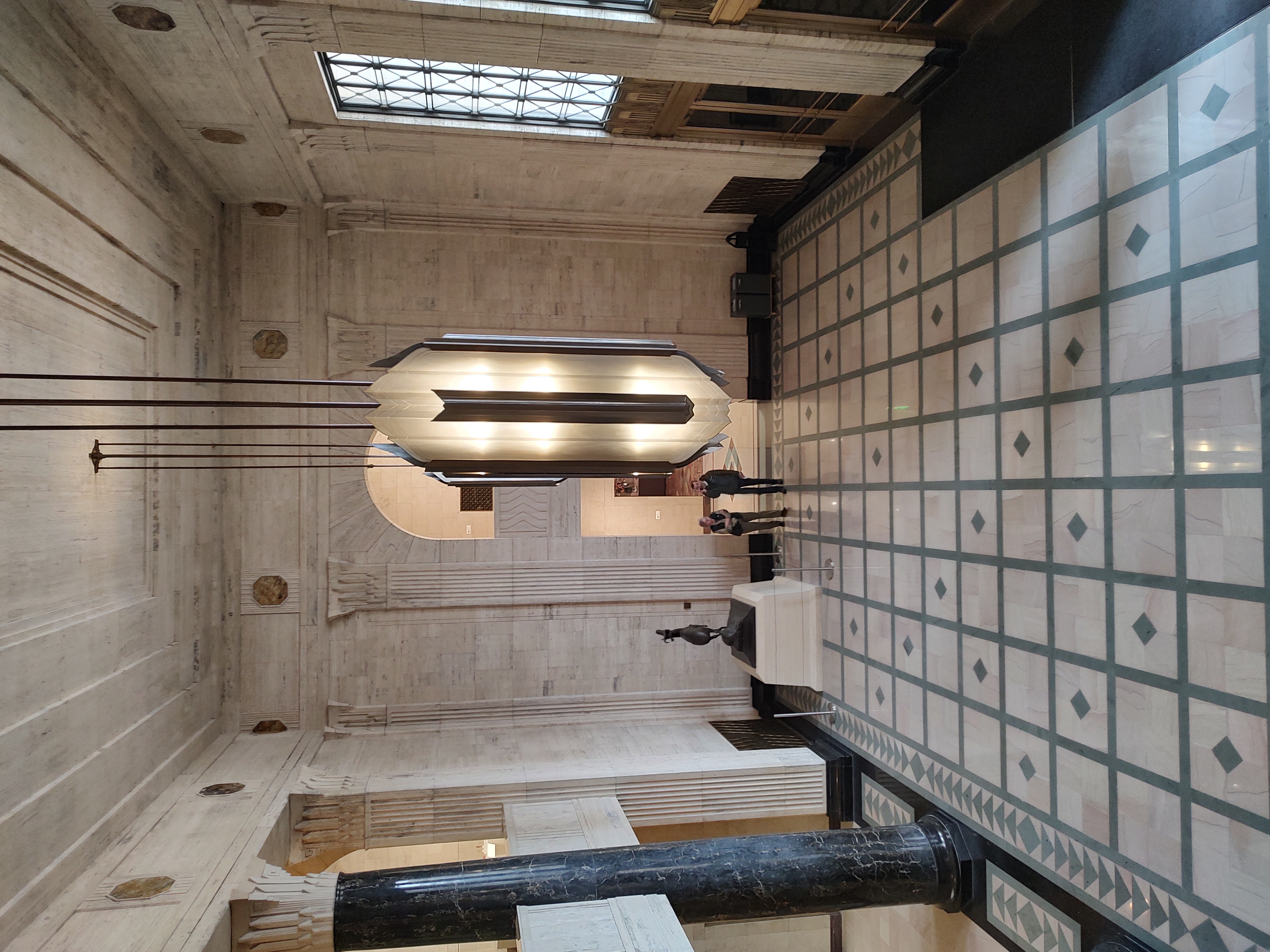 A stunning marbled art deco entry hall, ready to greet everyone with beauty, for those who seek it.<br />(Austin Petak / The Daily Record)