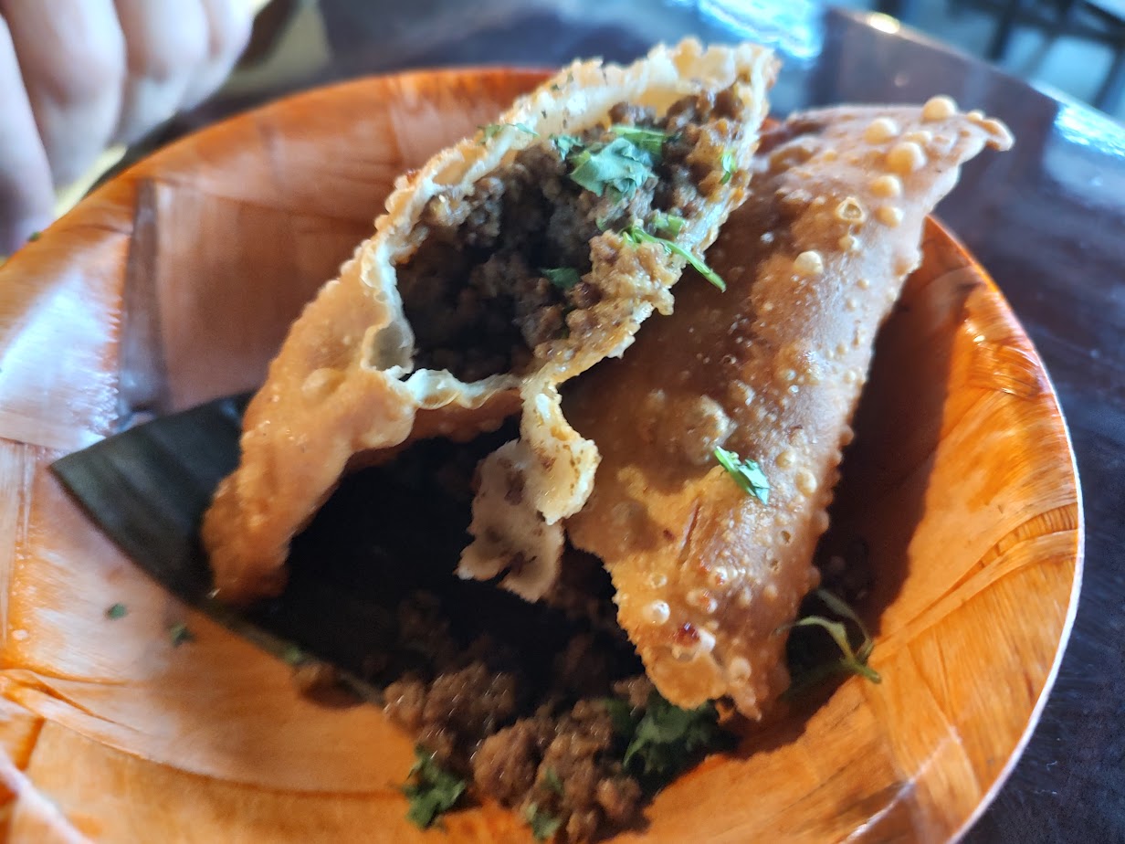 Beef turnovers, both splendidly cooked, the shell done just right with nothing too oily, slick, or hard. A fantastic crunch with wonderfully spiced ground beef.<br />(Austin Petak / The Daily Record)