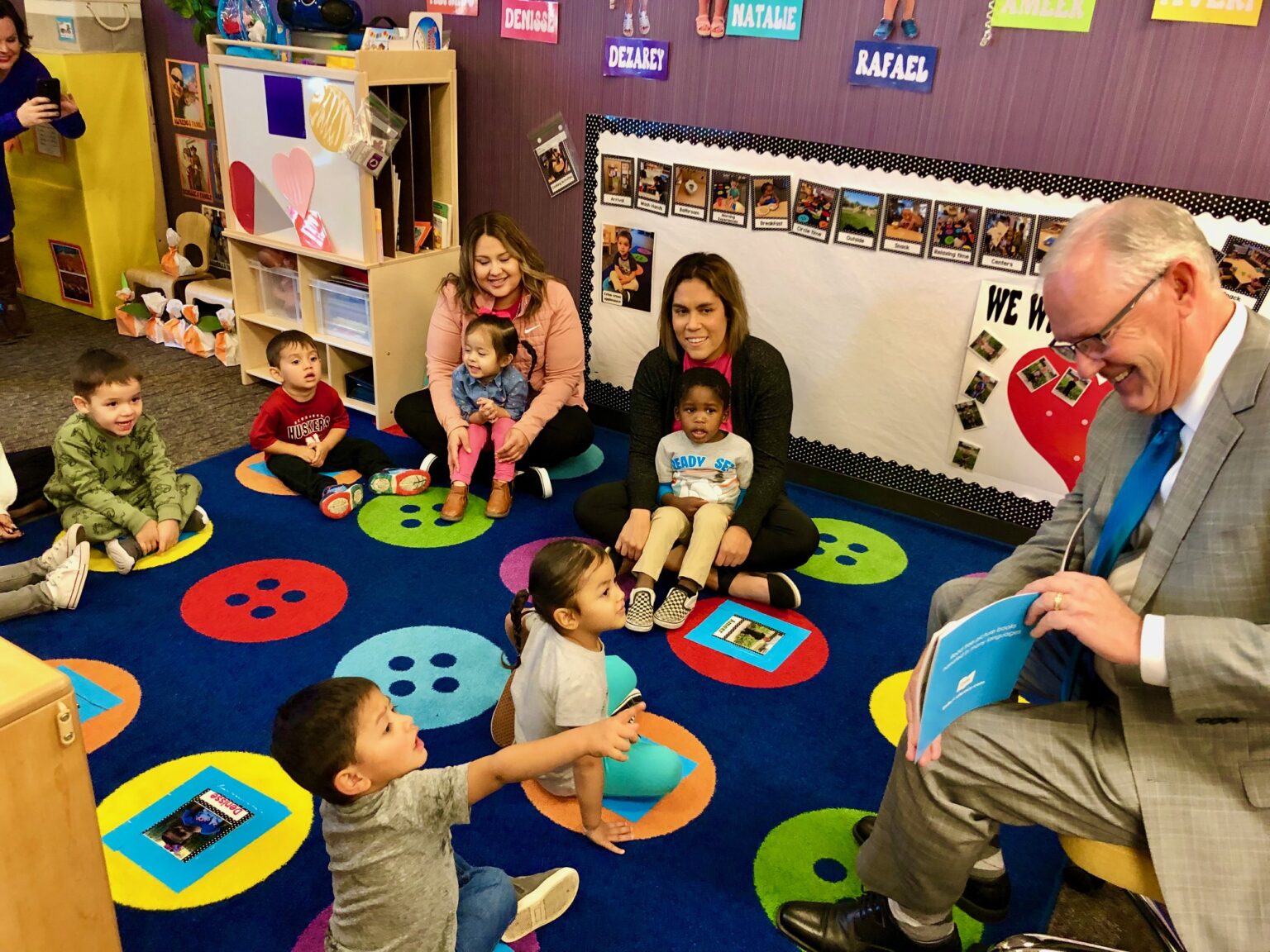 Brian Maher, Nebraska&#039;s education commissioner, reads a book to a group of mostly 3-year-olds as he and others launch a statewide project to boost reading skills of pre-kindergarteners on Oct. 30, 2023.<br />(Cindy Gonzalez / Nebraska Examiner)
