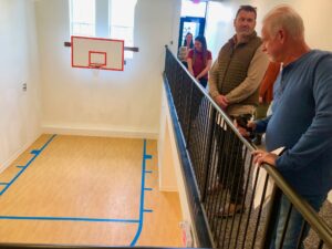 A basketball court was restored as a feature in the Lofts on Main historic renovation project. While people have been shooting around some, it is not supposed to be for actual basketball play, officials said, and likely will be a community social spot with, perhaps, a coffee bar.<br />(Cindy Gonzalez / Nebraska Examiner)