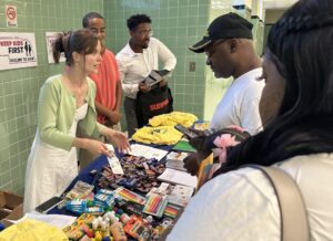 Parents in North Omaha listen to the pitch from Keep Kids First, which advocates for protecting Nebraska’s new Opportunity Scholarships Act.<br />(Aaron Sanderford / Nebraska Examiner)
