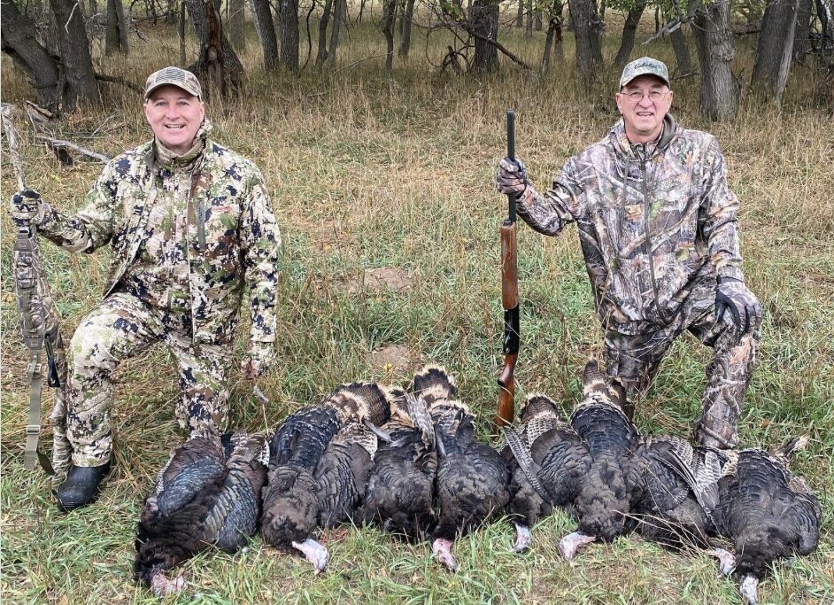 U.S. Sen. Pete Ricketts (at left) then Nebraska’s governor, celebrates his hunt near Chadron in 2022 with State Sen. Myron Dorn of Adams. Ricketts has now bought land in the area.<br />(Courtesy of Nebraska Governor’s Office)