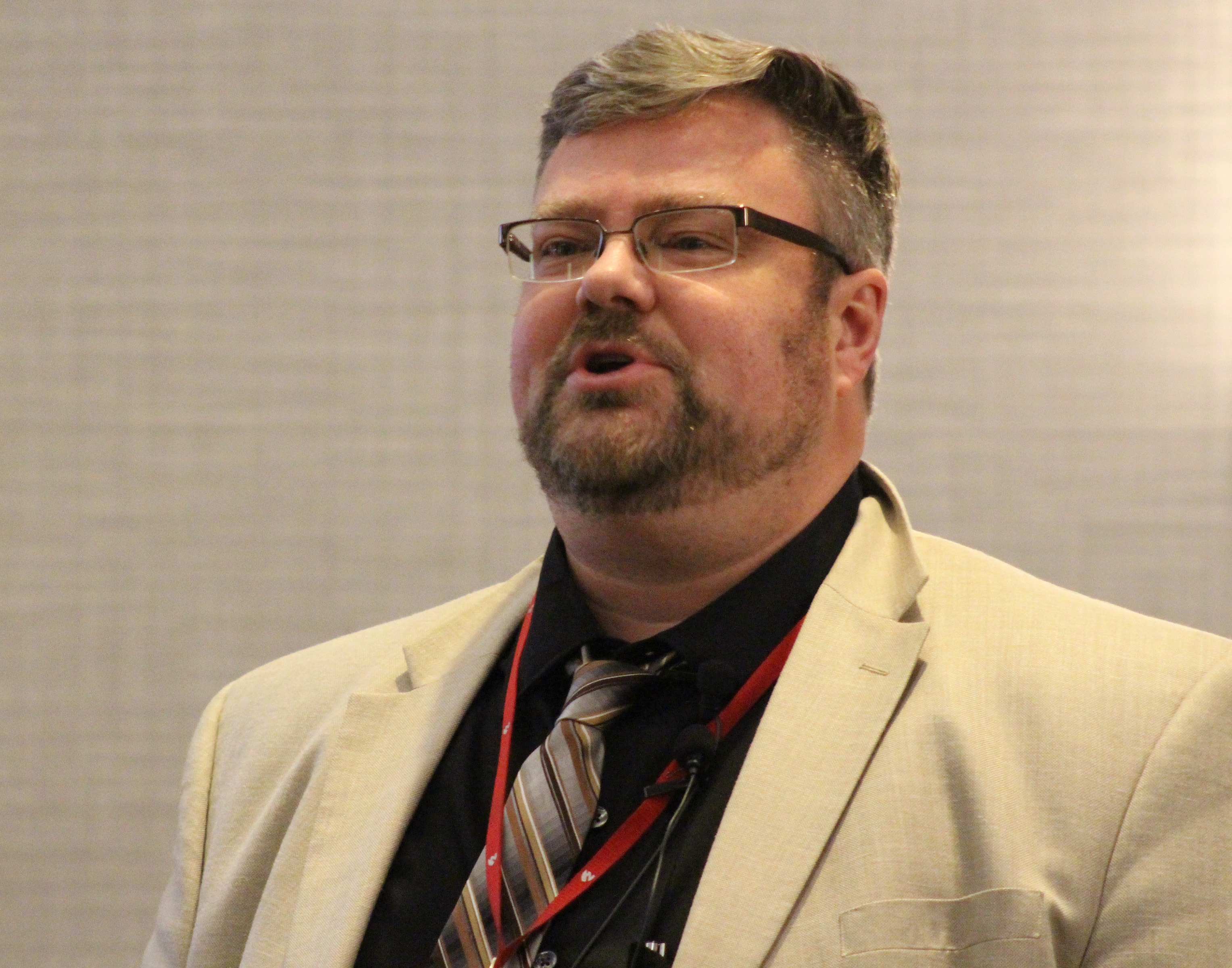 Matthew Garlinghouse, a professor of neuropsychology at the University of Nebraska Medical Center, addresses the crowd at the Medical Legal Dinner, a joint event held by the Omaha Bar Association and Metro Omaha Medical Society, on Thursday, March 5, 2020. (Photo by Scott Stewart)