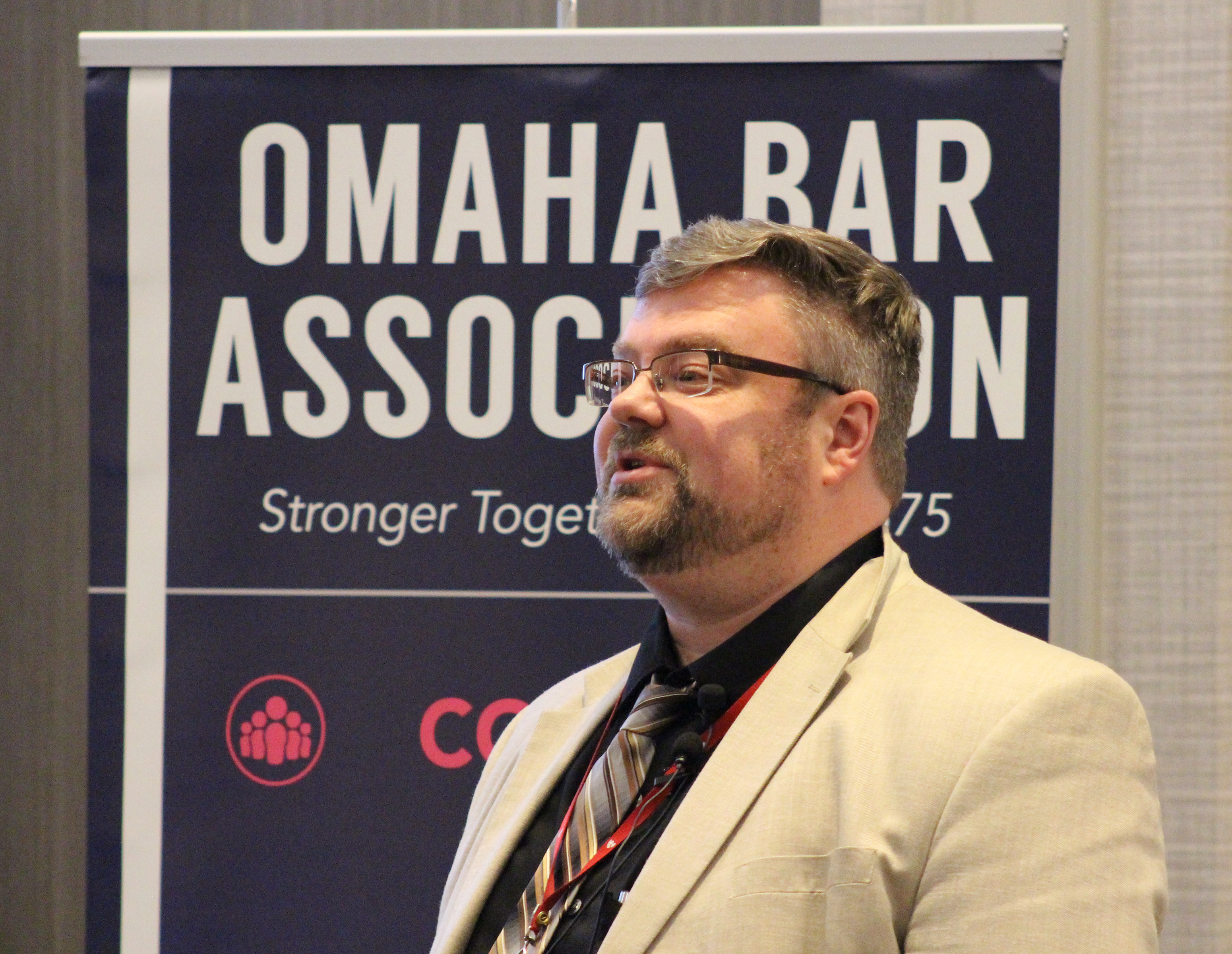 Matthew Garlinghouse, a professor of neuropsychology at the University of Nebraska Medical Center, addresses the crowd at the Medical Legal Dinner, a joint event held by the Omaha Bar Association and Metro Omaha Medical Society, on Thursday, March 5, 2020. (Photo by Scott Stewart)