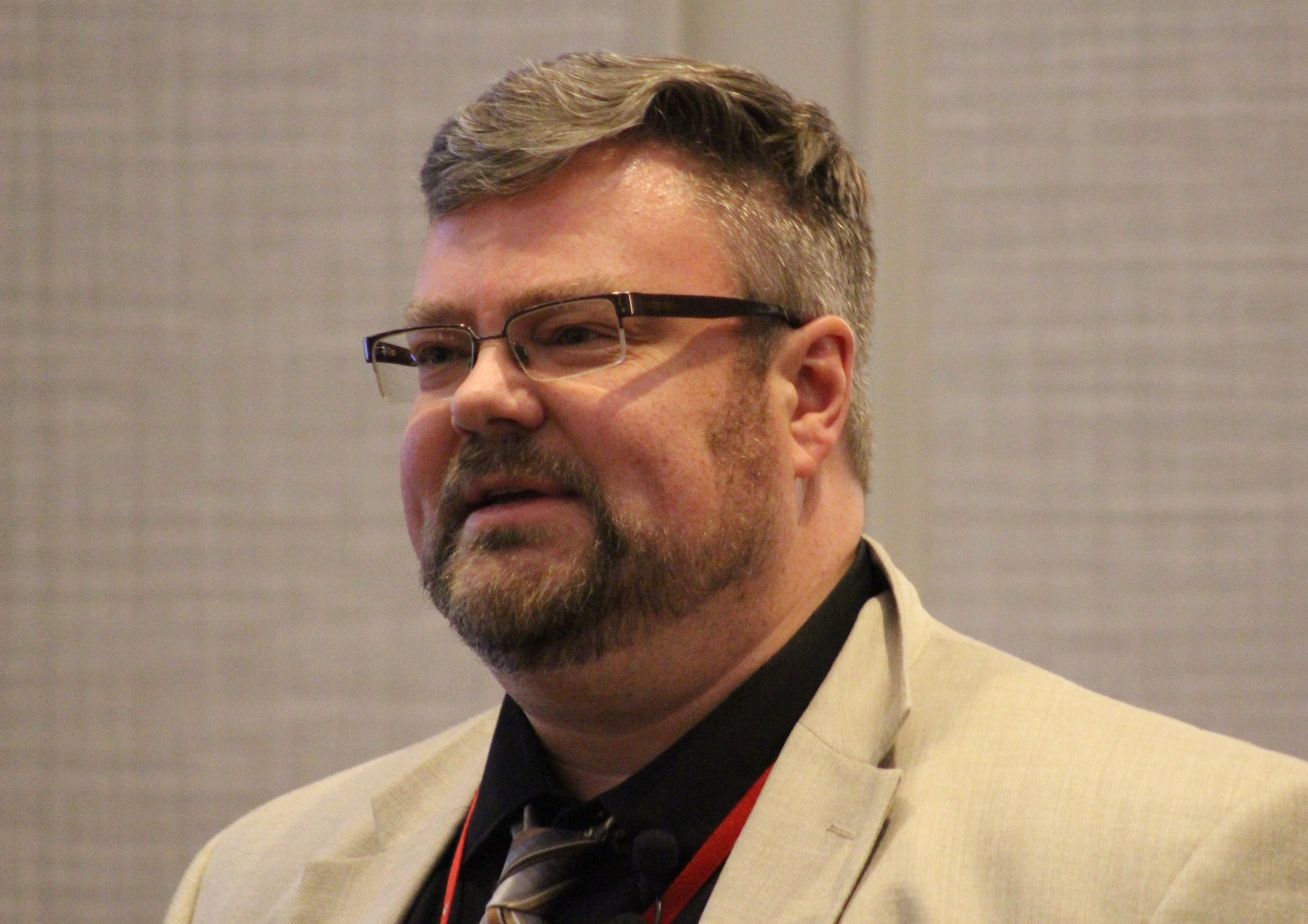 Matthew Garlinghouse, a professor of neuropsychology at the University of Nebraska Medical Center, addresses the crowd at the Medical Legal Dinner, a joint event held by the Omaha Bar Association and Metro Omaha Medical Society, on Thursday, March 5, 2020. (Photo by Scott Stewart)