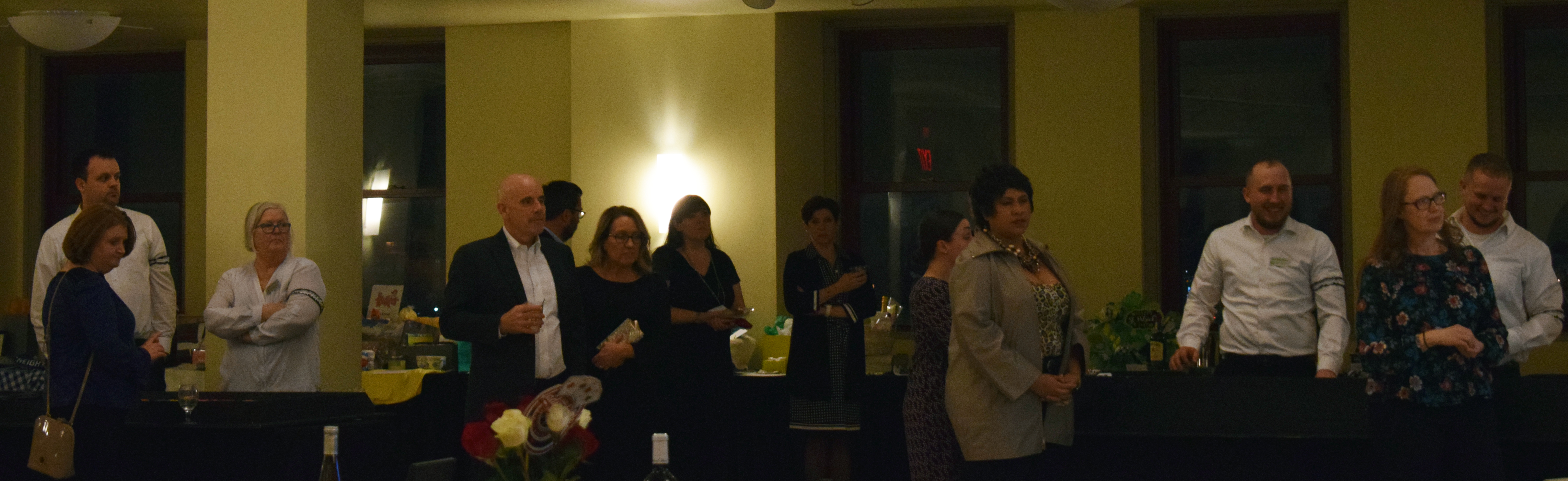 Guests turn their attention to the presentation of the service award at the Omaha Law League Casino Night at the Livestock Exchange Building on March 6, 2020. (Photo by Elizabeth A. Elliott)
