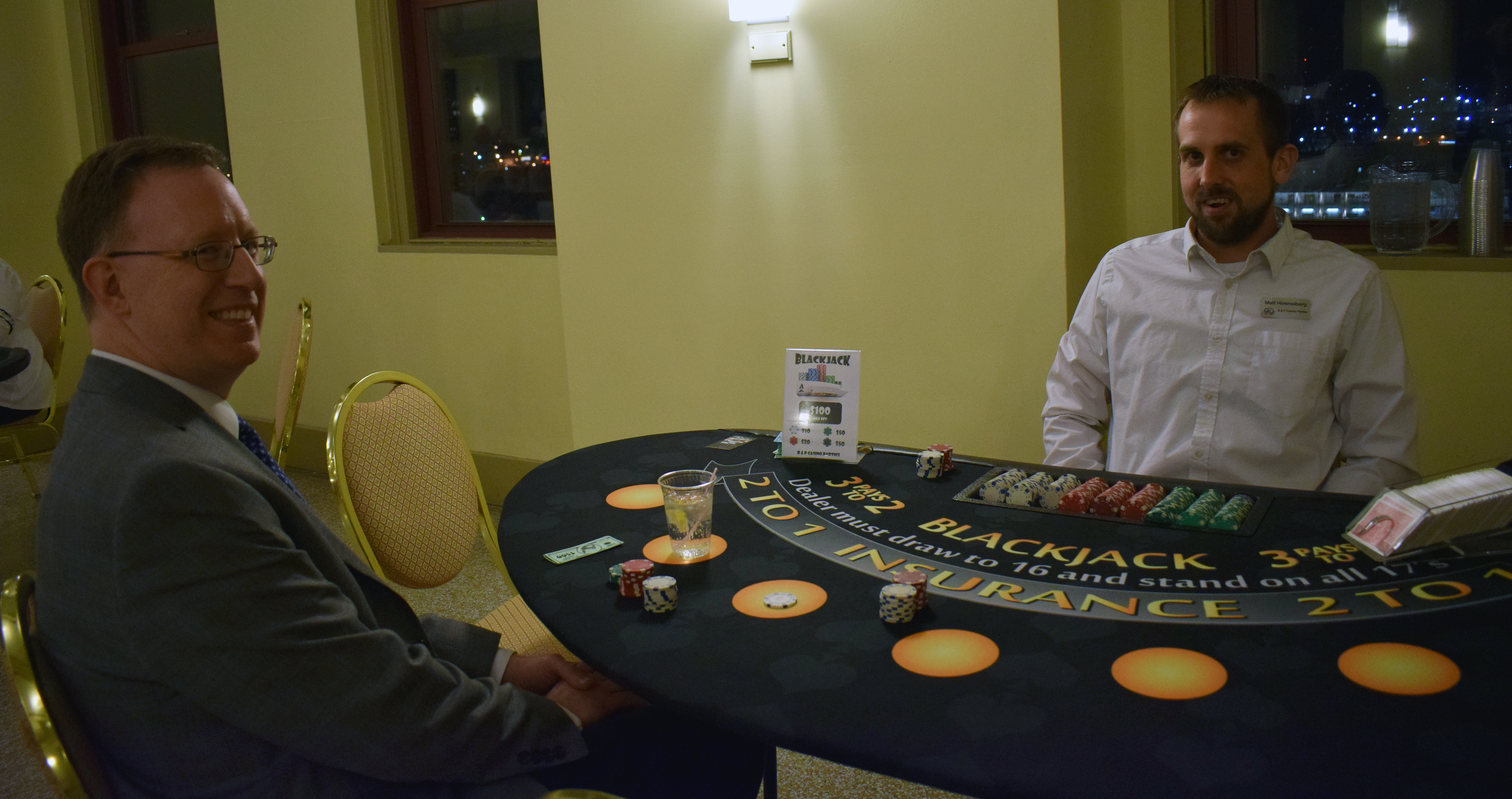 Matt Kuhse starts a round of blackjack at Casino Night at the Omaha Law League Casino Night at the Livestock Exchange Building on March 6, 2020. (Photo by Elizabeth A. Elliott)